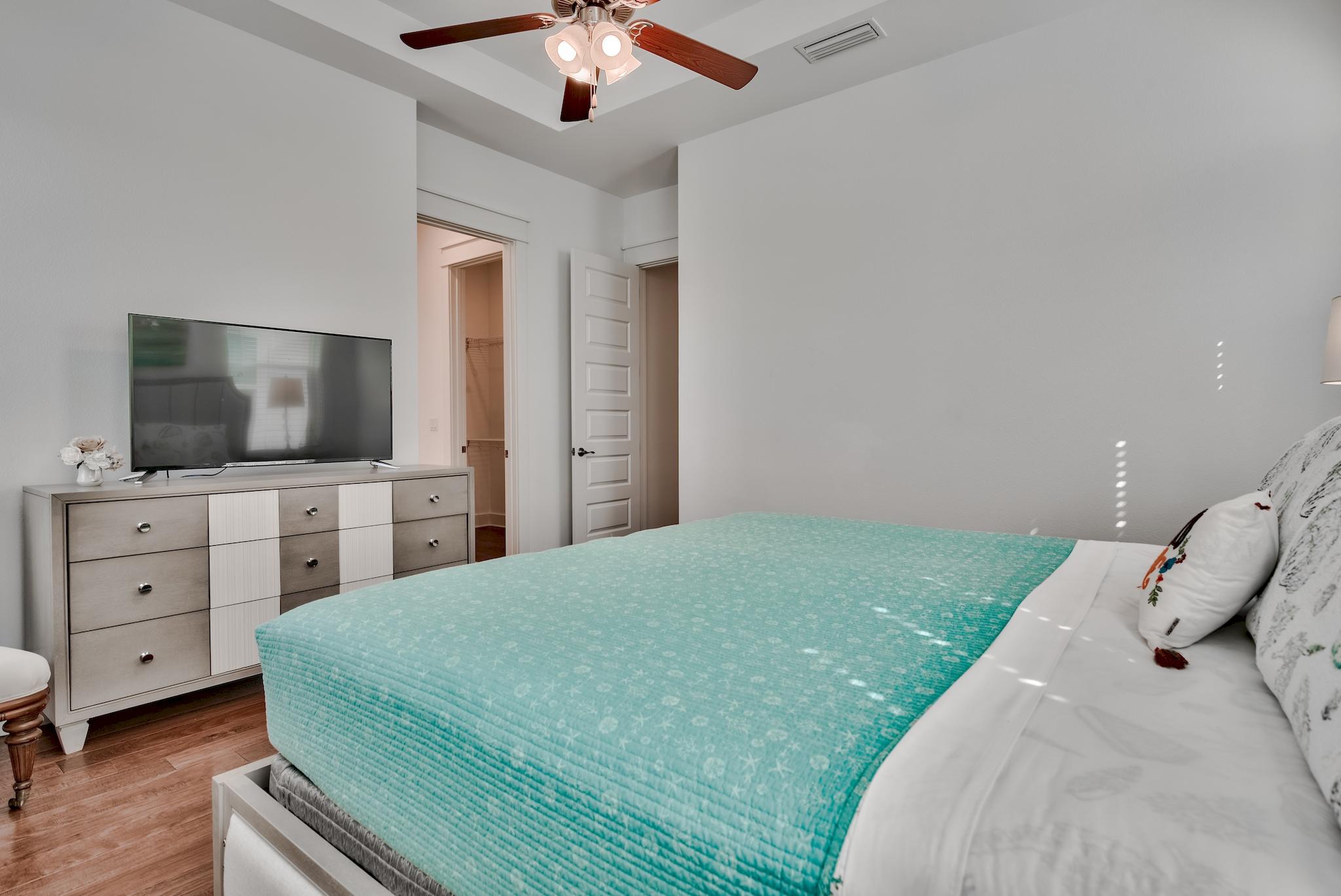 18 Milestone Drive Inlet Beach, Unit A Inlet Beach, FL 32461 - Photo 12 of 39 a spacious bedroom with a bed and a flat screen tv