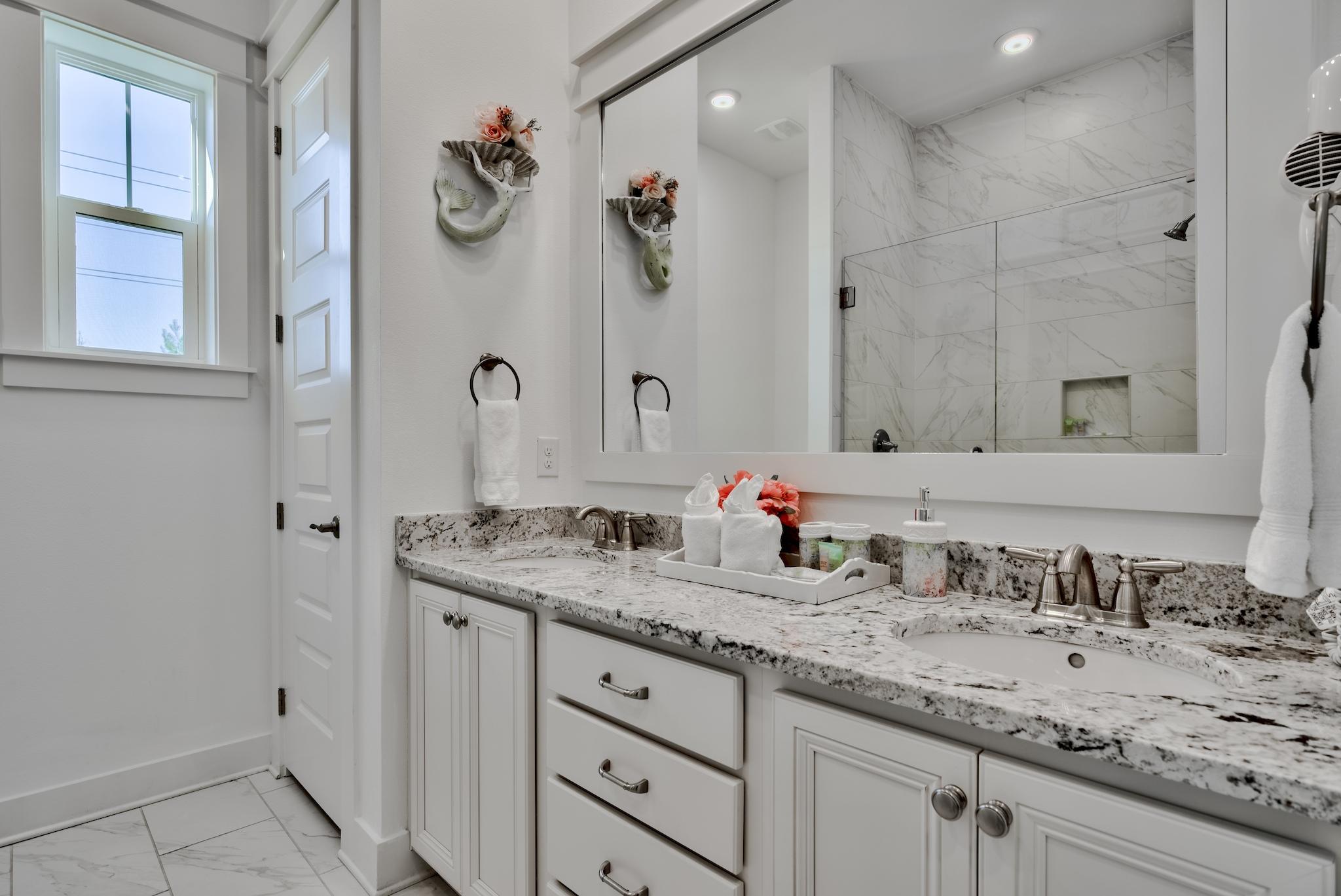 18 Milestone Drive Inlet Beach, Unit A Inlet Beach, FL 32461 - Photo 13 of 39 a bathroom with a granite countertop sink and a mirror
