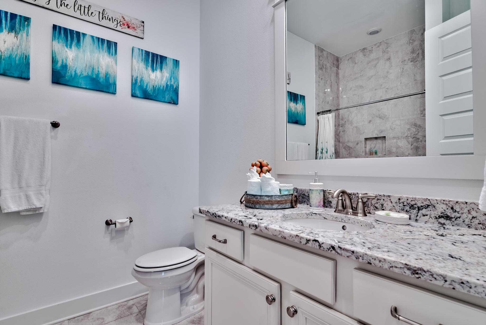 18 Milestone Drive Inlet Beach, Unit A Inlet Beach, FL 32461 - Photo 16 of 39 a bathroom with a granite countertop sink and a toilet