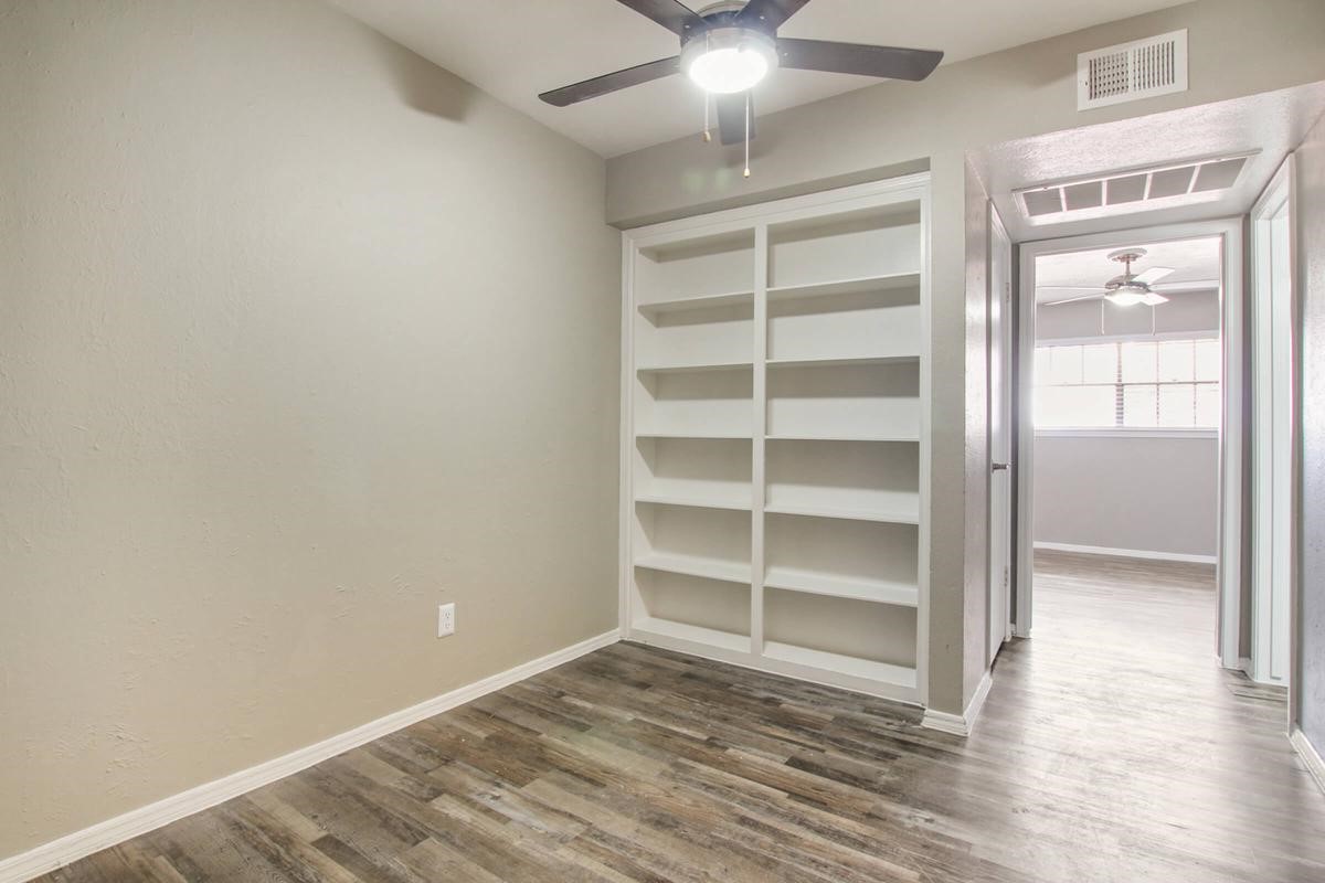 1212 Hampshire Lane, Unit 2041 Richardson, TX 75080 - Photo 10 of 50 a view of a room with wooden floor and closet