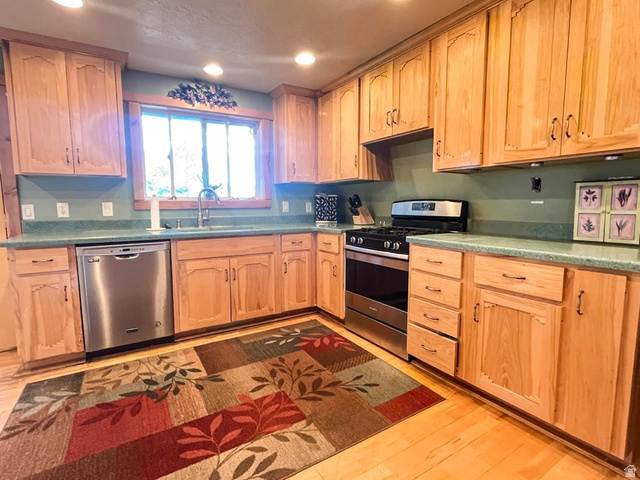 2498 West Silverado Ridge Alton, UT 84710 - Photo 11 of 51 Kitchen with stainless steel appliances, light wood-type flooring, recessed lighting, and light wood finish cabinets