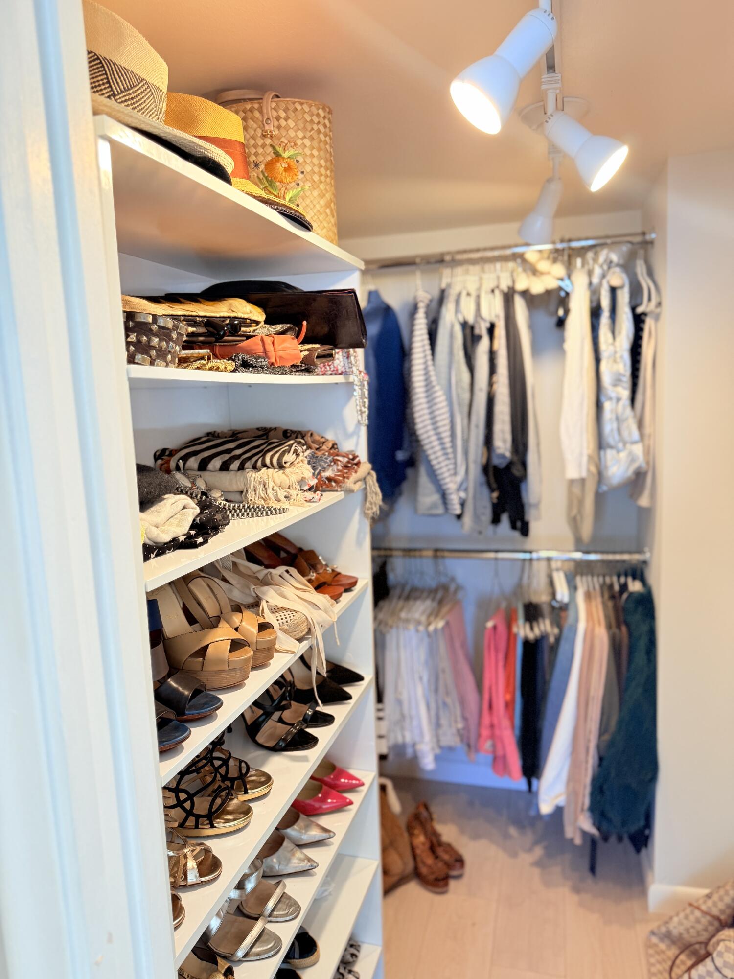 5200 North Flagler Drive, Unit 1406 West Palm Beach, FL 33407 - Photo 22 of 31 a view of walk in closet with clothes and shoes