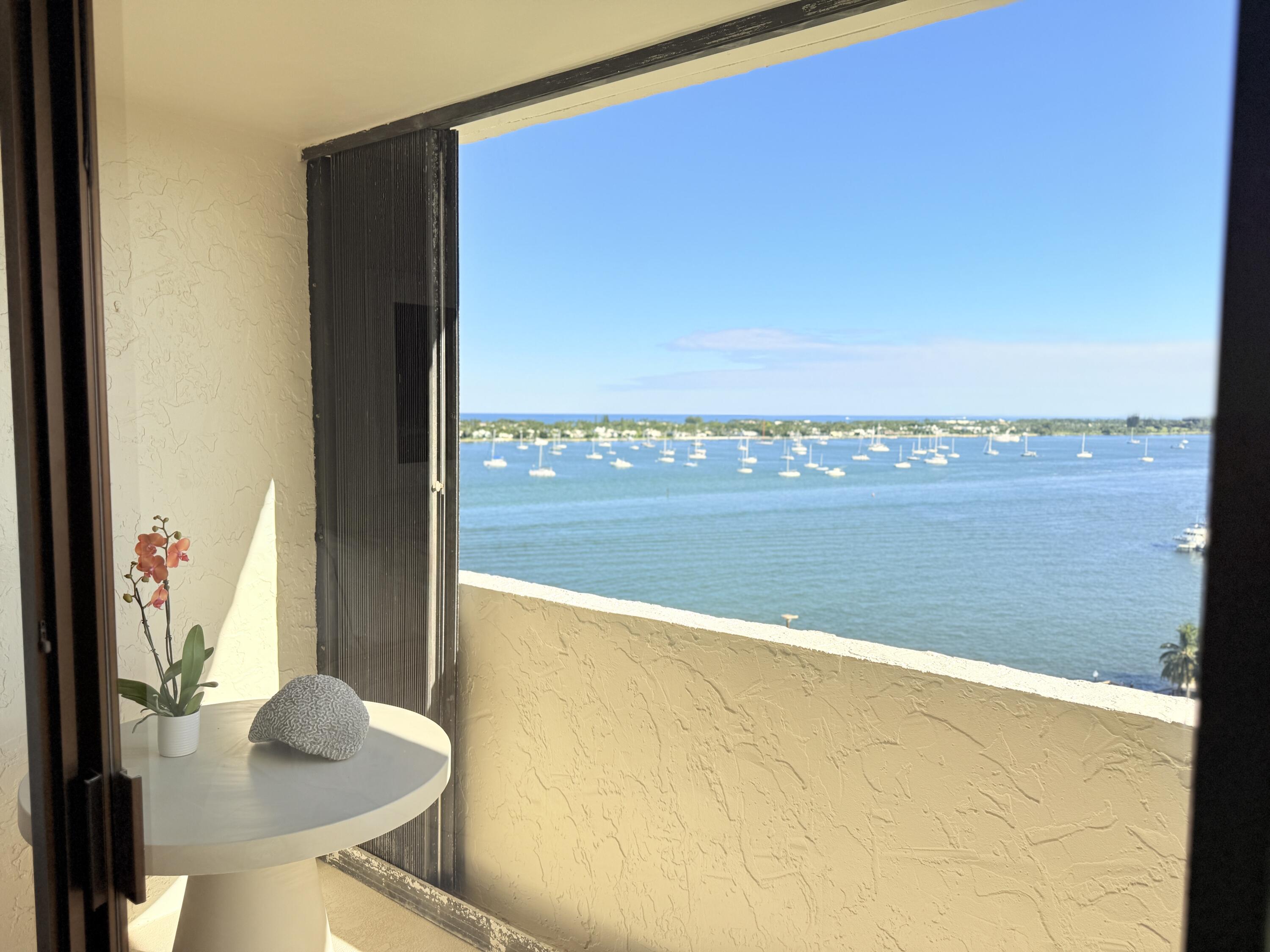 5200 North Flagler Drive, Unit 1406 West Palm Beach, FL 33407 - Photo 25 of 31 a view of a balcony next to a yard