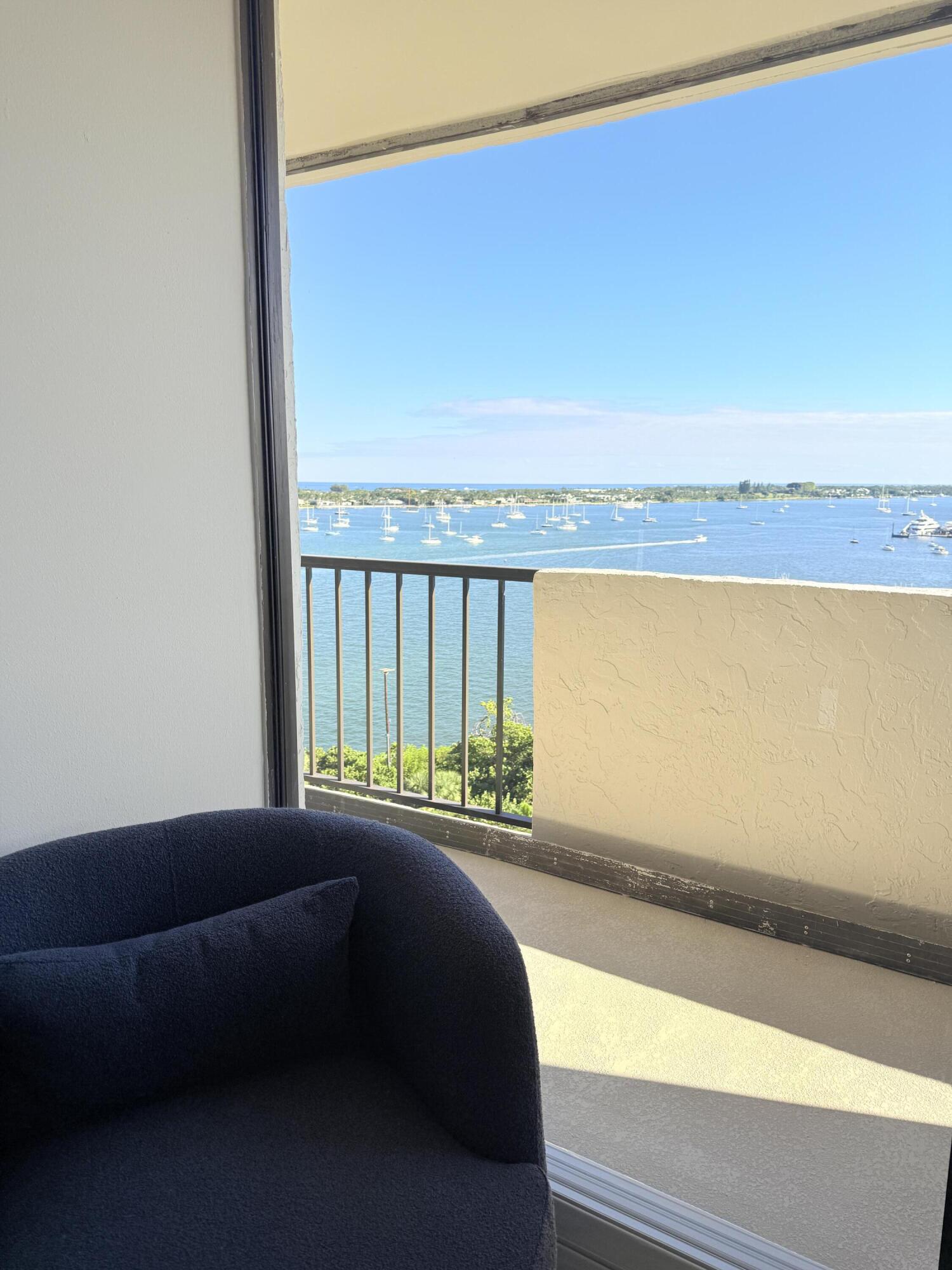 5200 North Flagler Drive, Unit 1406 West Palm Beach, FL 33407 - Photo 30 of 31 a living room with a couch
