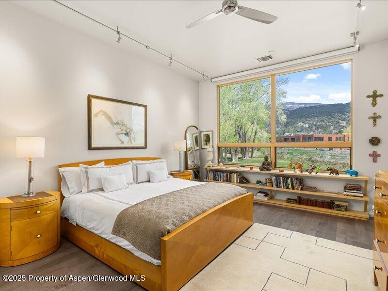 102 Evans Road, Unit 107 Basalt, CO 81621 - Photo 11 of 25 a large bed sitting in a room next to a lamp