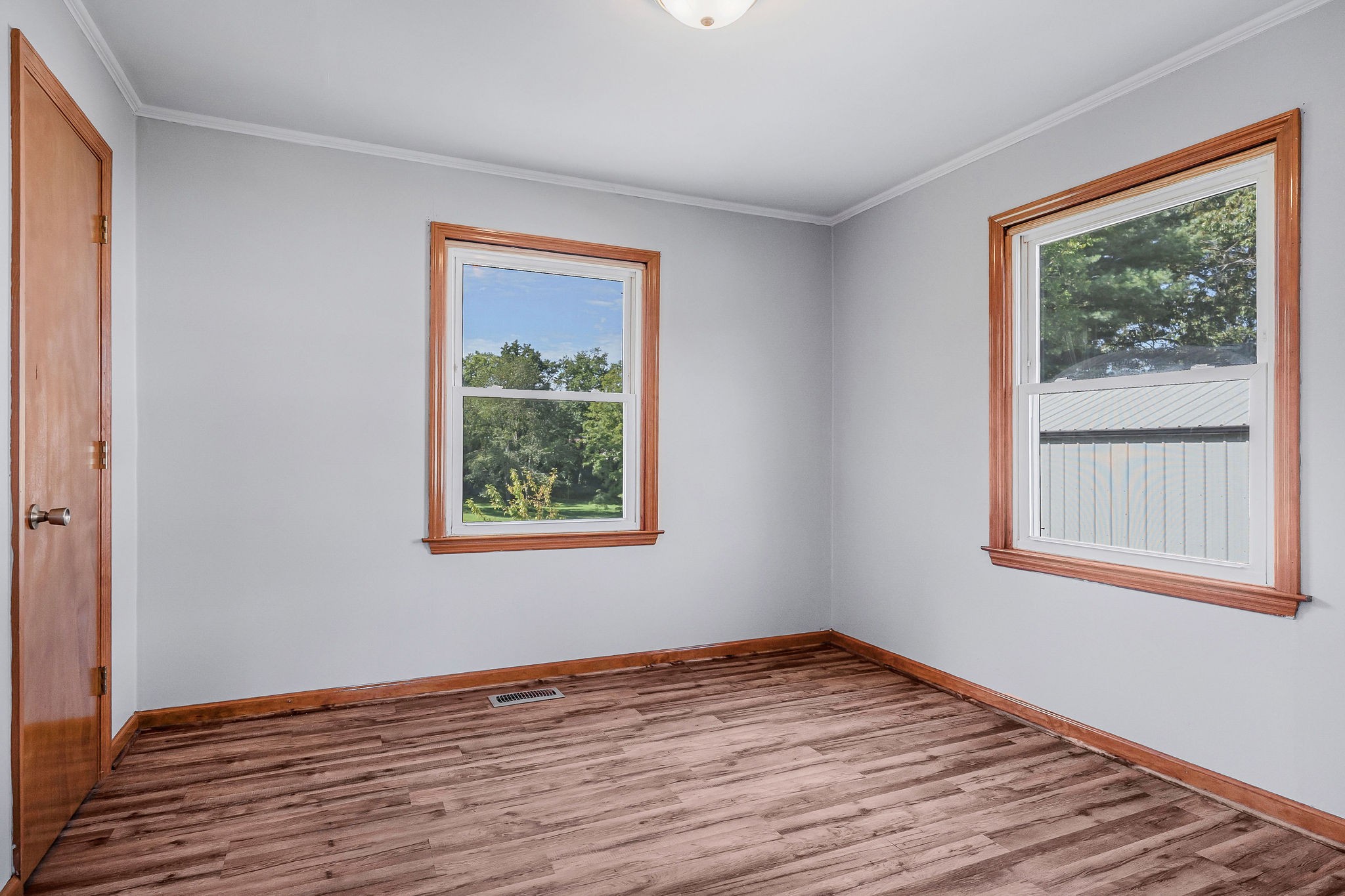 220 Higginbotham Road McMinnville, TN 37110 - Photo 12 of 21 a view of an empty room with wooden floor and a window