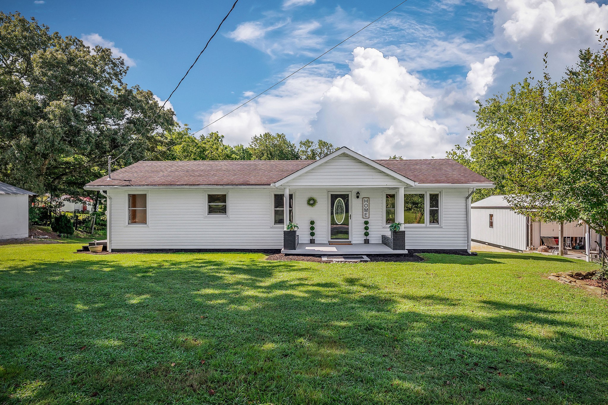 220 Higginbotham Road McMinnville, TN 37110 - Photo 15 of 21 a front view of a house with a garden