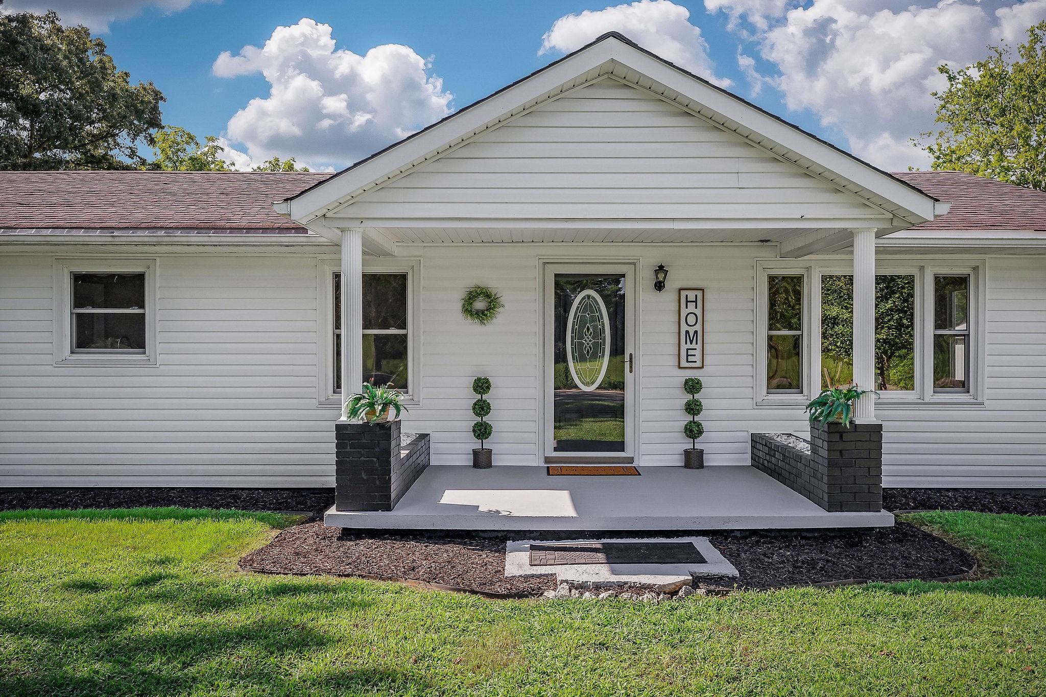 220 Higginbotham Road McMinnville, TN 37110 - Photo 16 of 21 a front view of a house with garden