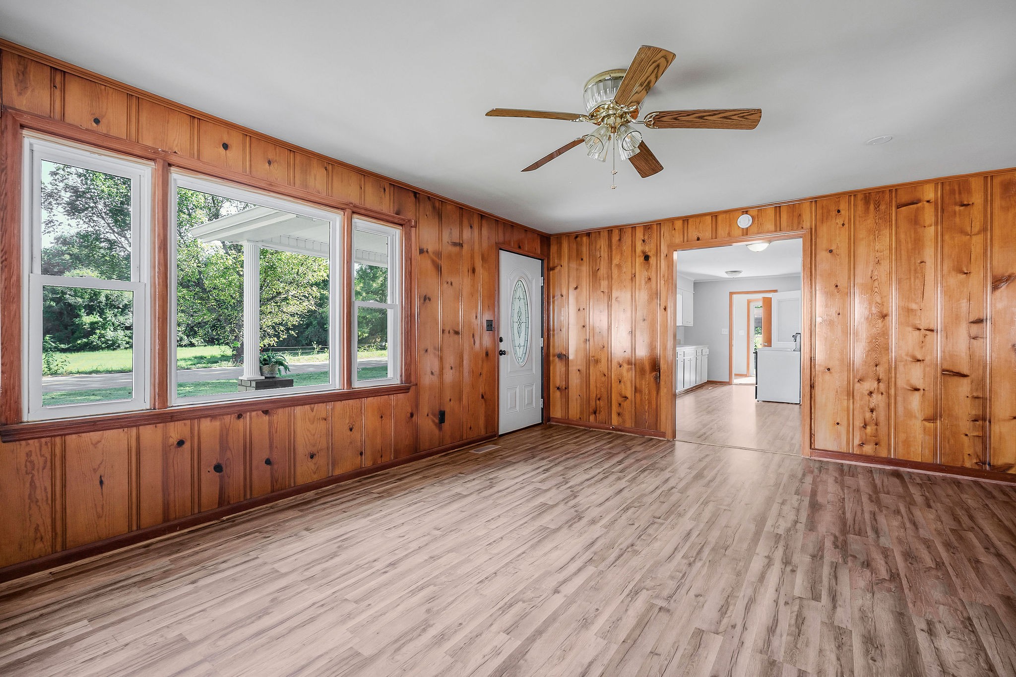 220 Higginbotham Road McMinnville, TN 37110 - Photo 3 of 21 a view of an empty room with a window and wooden floor