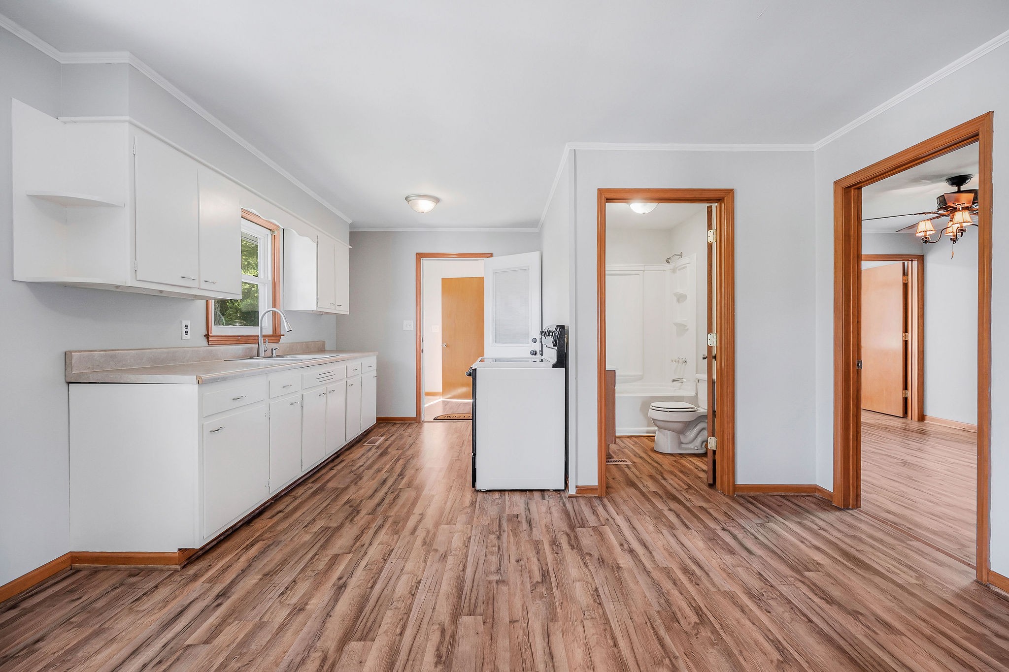 220 Higginbotham Road McMinnville, TN 37110 - Photo 4 of 21 a kitchen with a wooden floor and white appliances