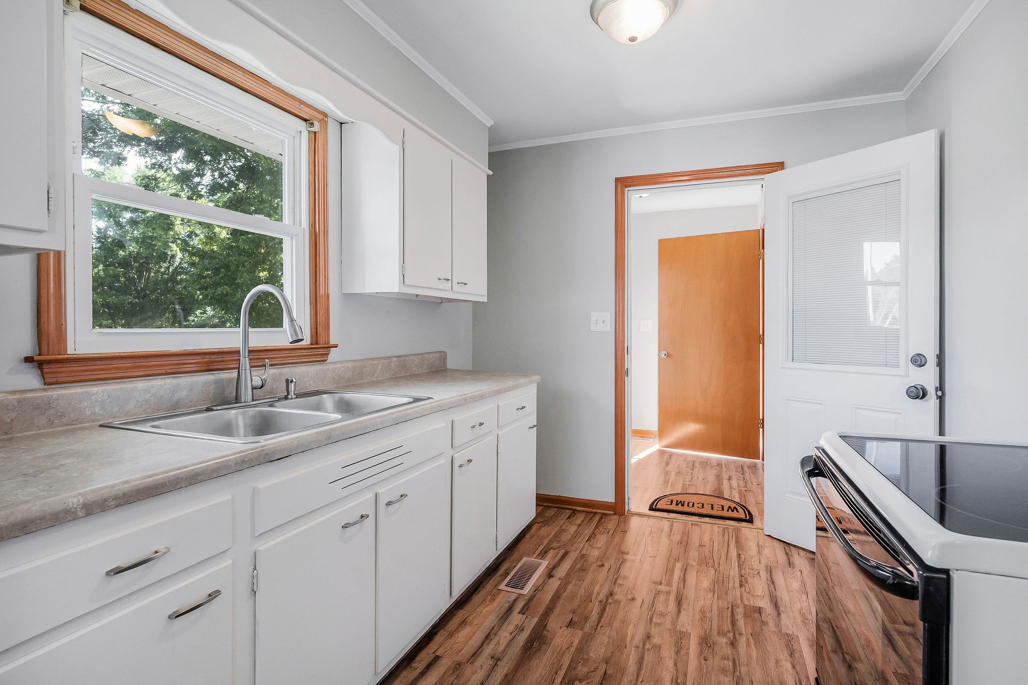 220 Higginbotham Road McMinnville, TN 37110 - Photo 5 of 21 a kitchen with a sink and wooden floor