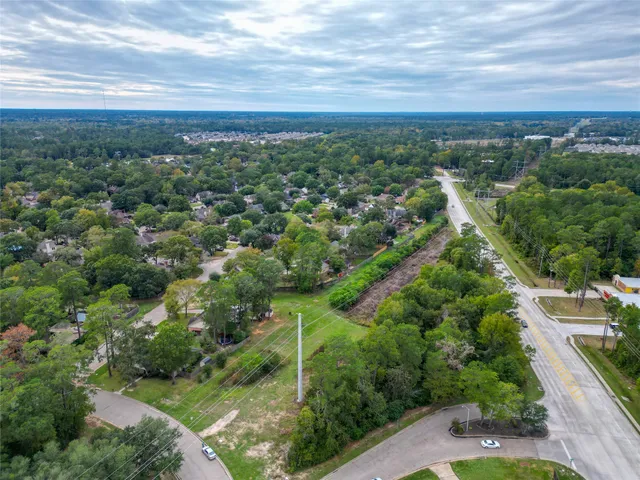 an aerial view of residential house with green space