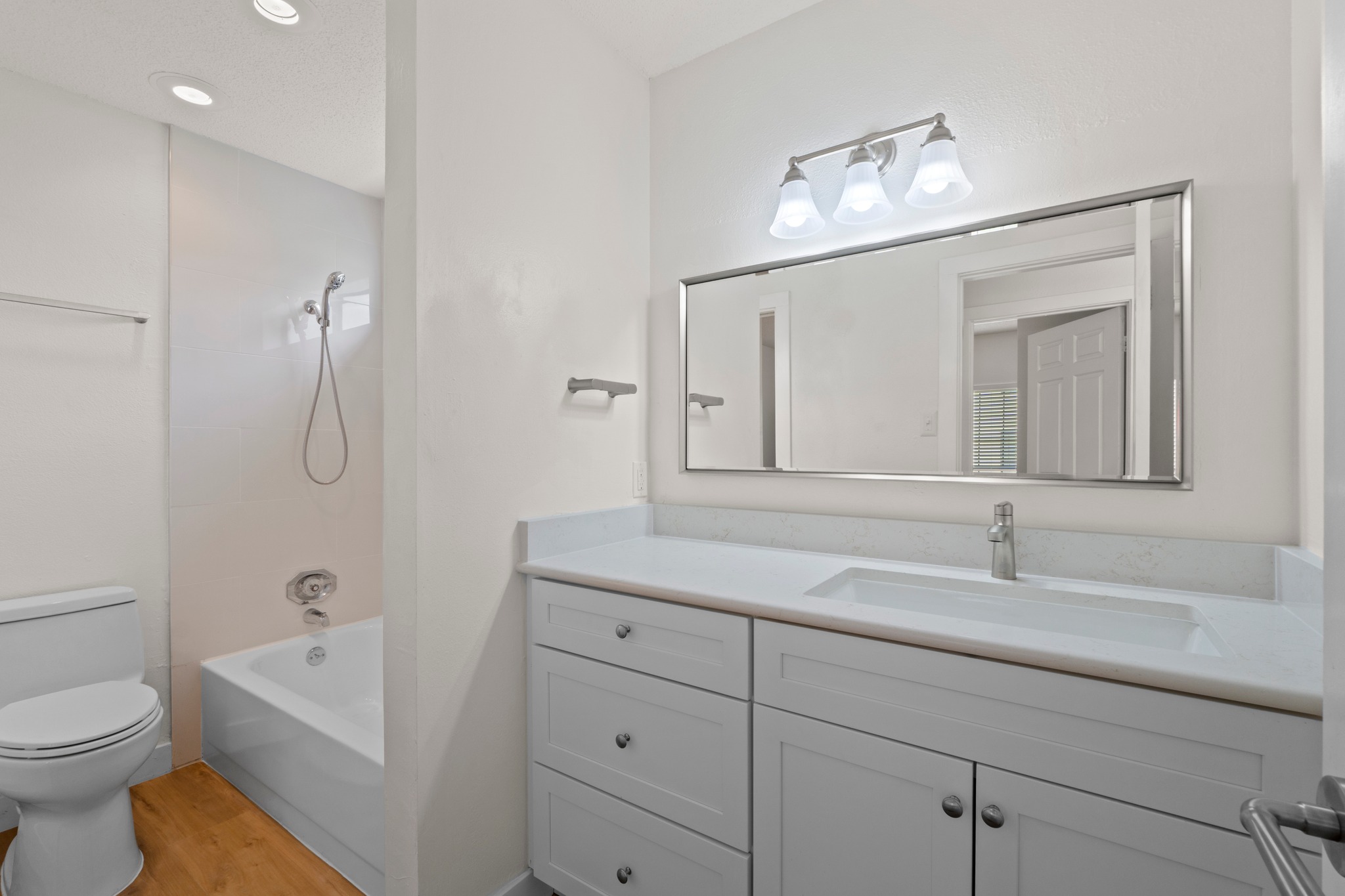 3001 Cedar Street, Unit A214 Austin, TX 78705 - Photo 17 of 23 a bathroom with a sink a toilet and shower