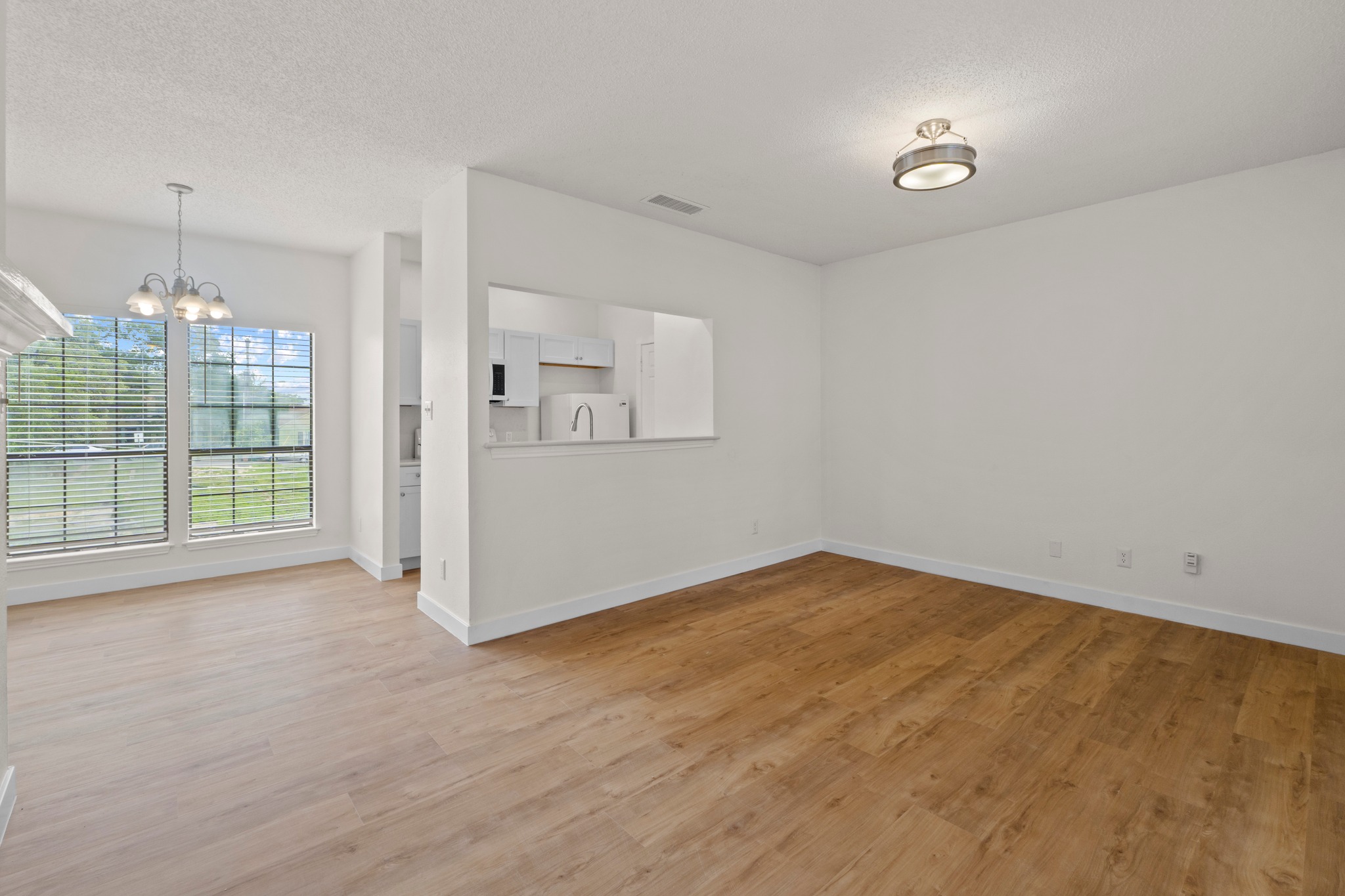 3001 Cedar Street, Unit A214 Austin, TX 78705 - Photo 4 of 23 an empty room with windows and outdoor view