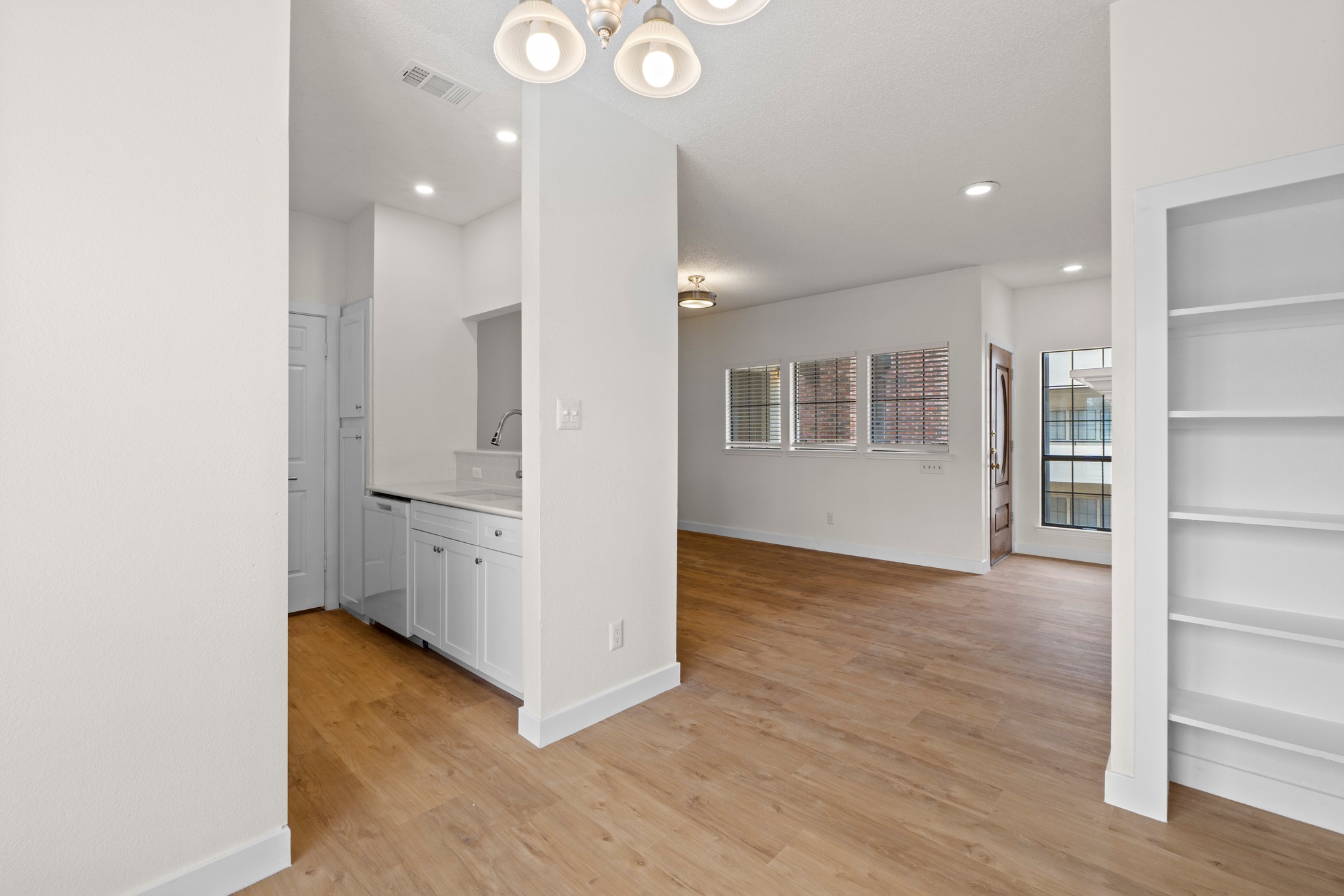 3001 Cedar Street, Unit A214 Austin, TX 78705 - Photo 10 of 23 a view of a kitchen with wooden floor and a kitchen