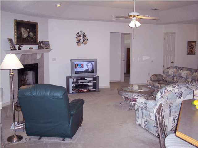 3623 Bagwell Road Pace, FL 32571 - Photo 11 of 24 Another view of family room from eat in kitchen. This room also operates off dimmer switch.