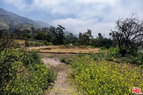 a view of a road with an ocean view