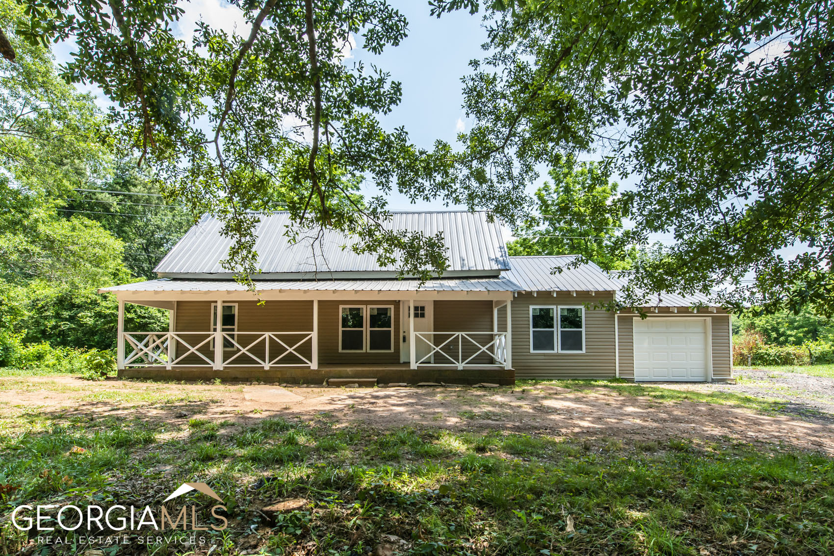 2212 Victory Church Road Bowdon, GA 30108 - Photo 1 of 1 a view of a house with backyard porch and sitting area