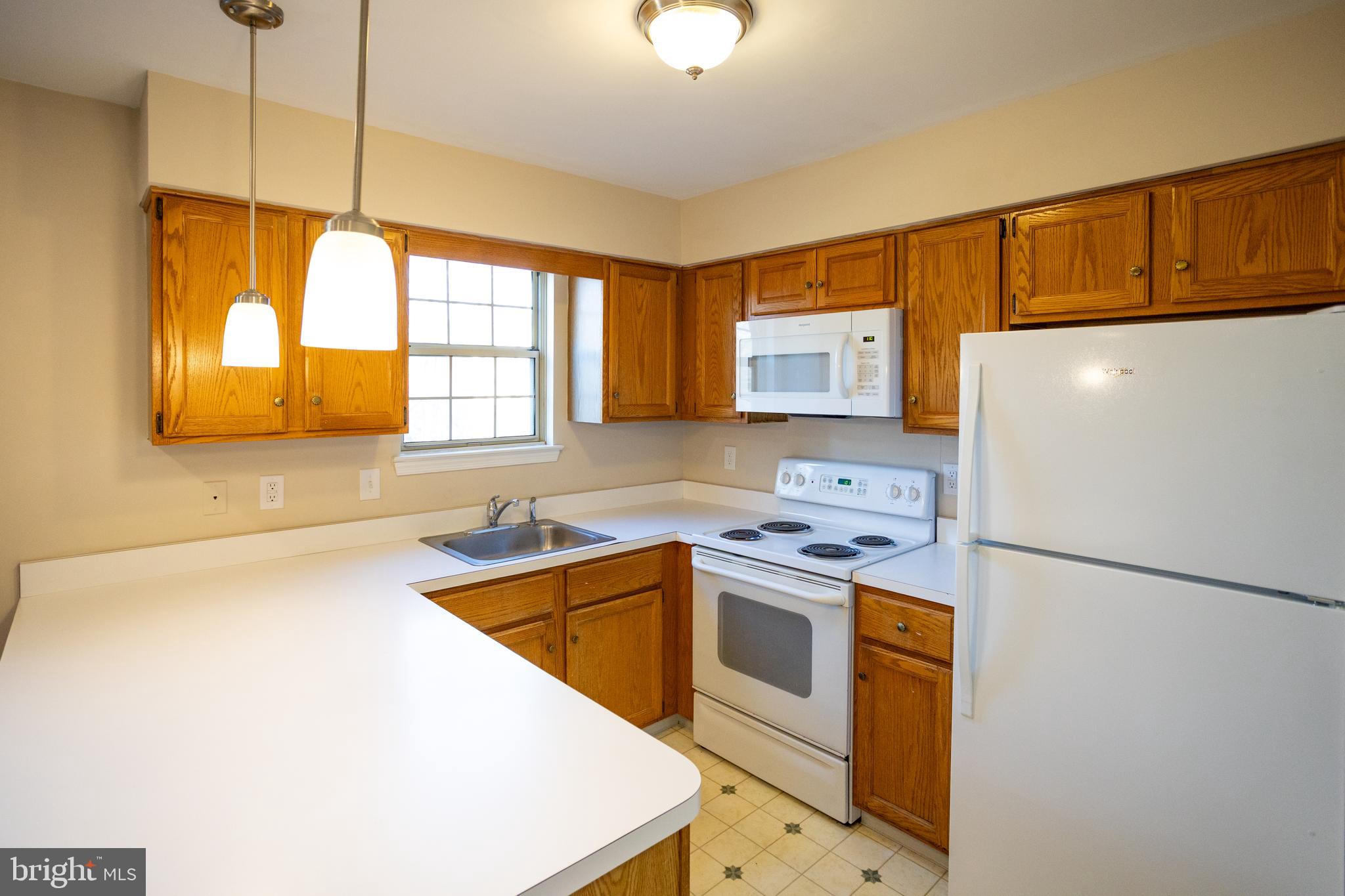 322 Kent Lane Perkasie, PA 18944 - Photo 13 of 36 a kitchen that has a sink a stove and a refrigerator
