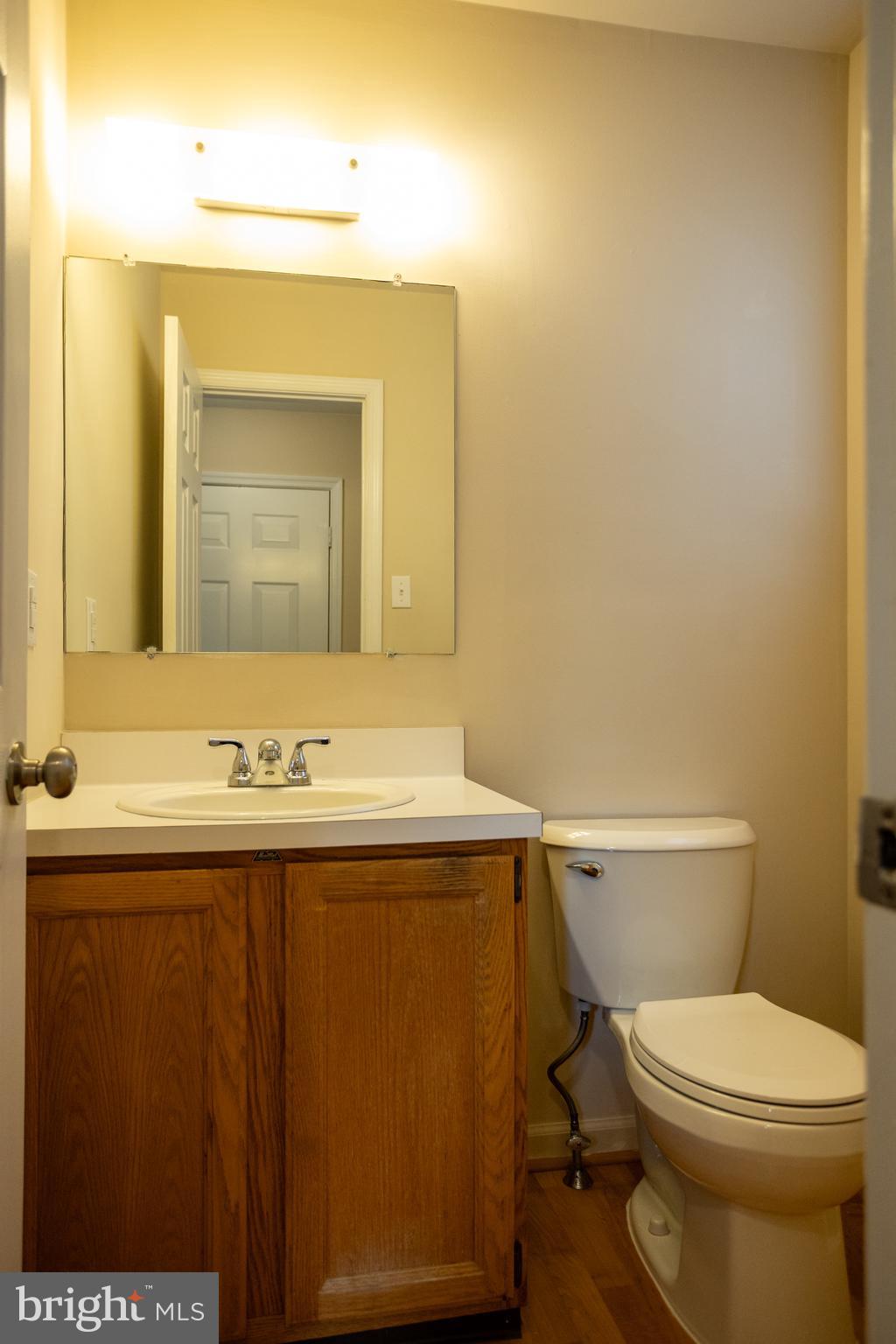 322 Kent Lane Perkasie, PA 18944 - Photo 16 of 36 a bathroom with a sink a toilet and mirror