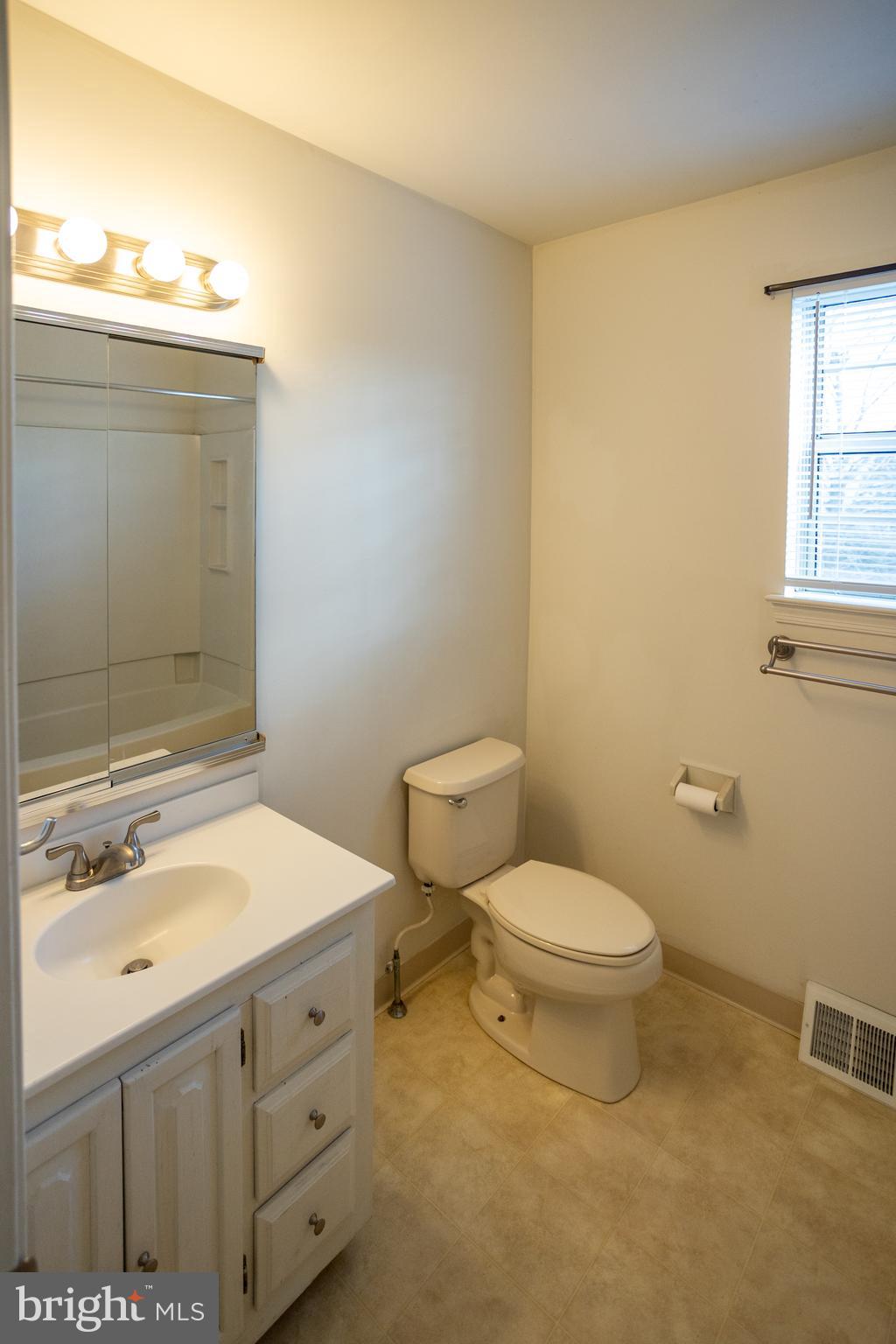 322 Kent Lane Perkasie, PA 18944 - Photo 18 of 36 a bathroom with a sink toilet and window
