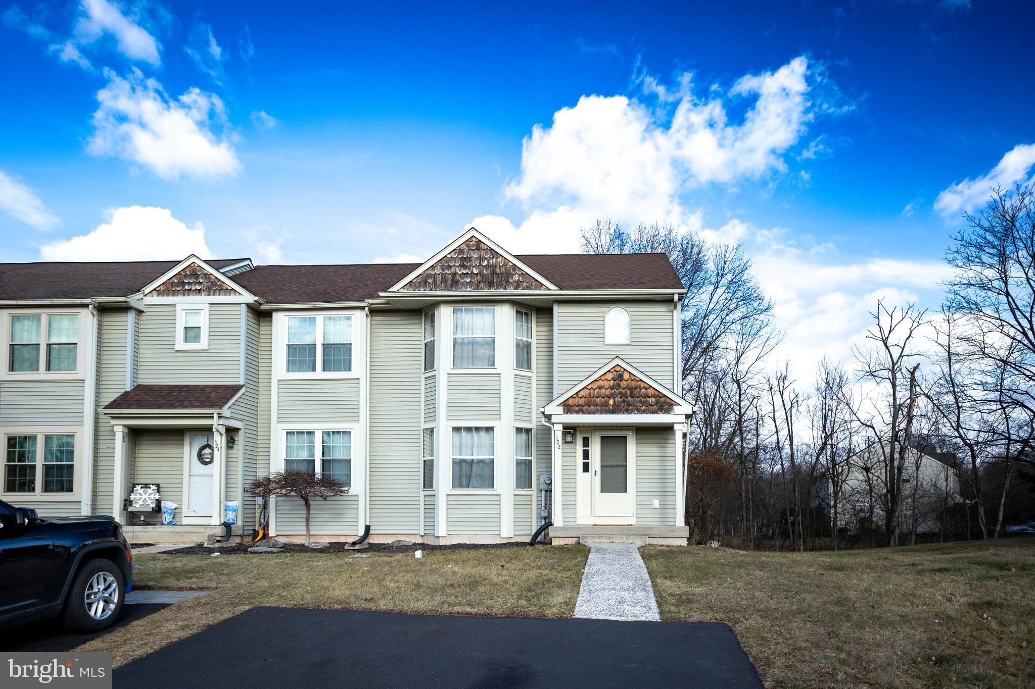 322 Kent Lane Perkasie, PA 18944 - Photo 4 of 36 a front view of a house with a yard