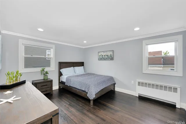 a spacious bedroom with a bed and a window