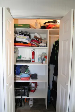 a room with storage and utility racks