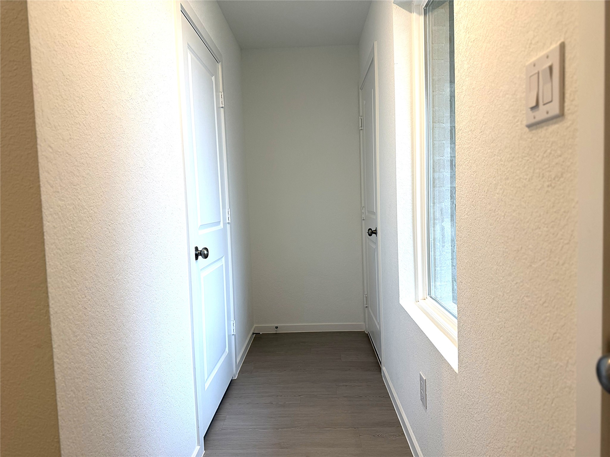 1511 Sunset Ridge Drive Conroe, TX 77306 - Photo 2 of 11 a view of a hallway with windows