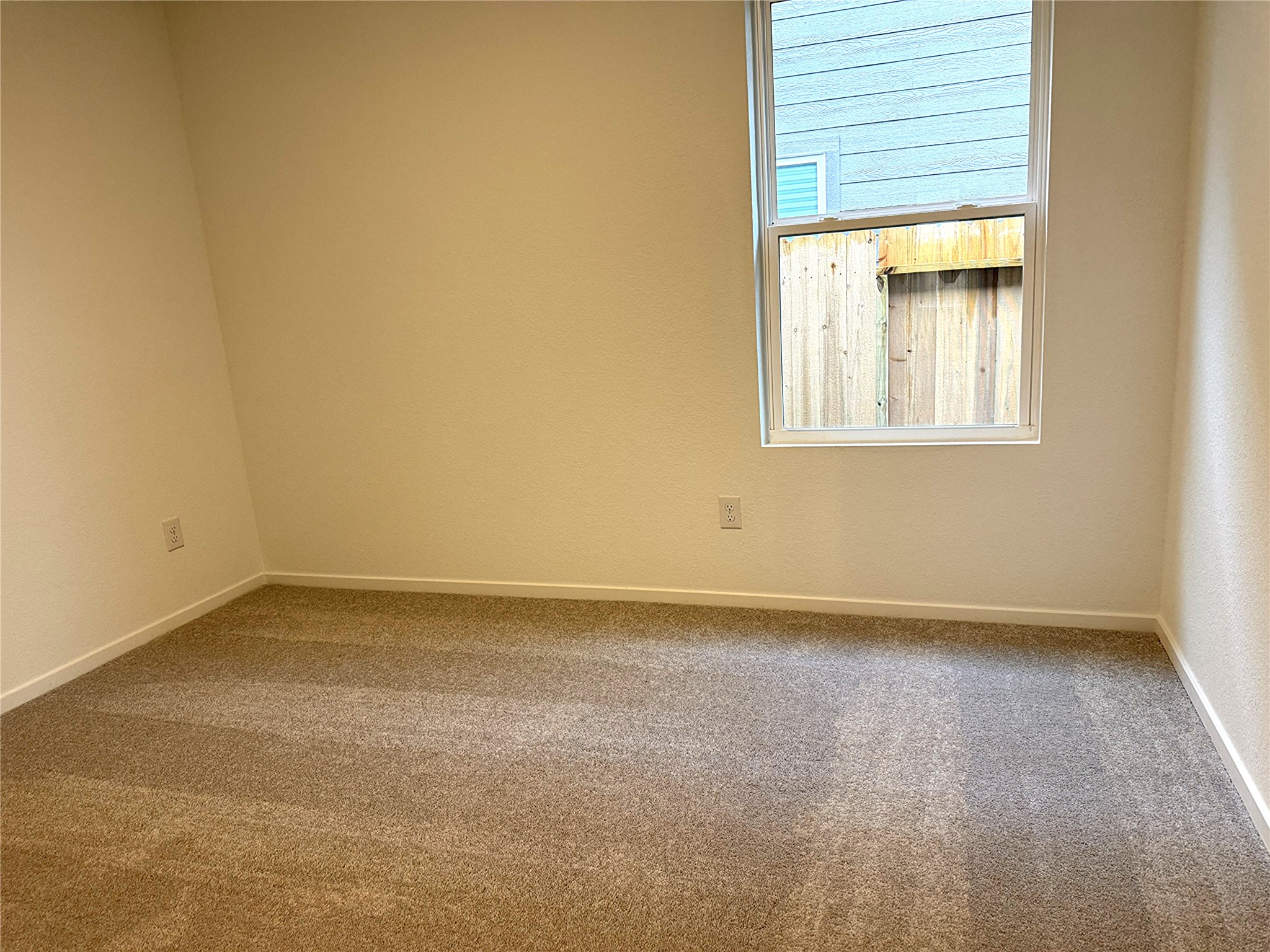 1511 Sunset Ridge Drive Conroe, TX 77306 - Photo 4 of 11 an empty room with a window