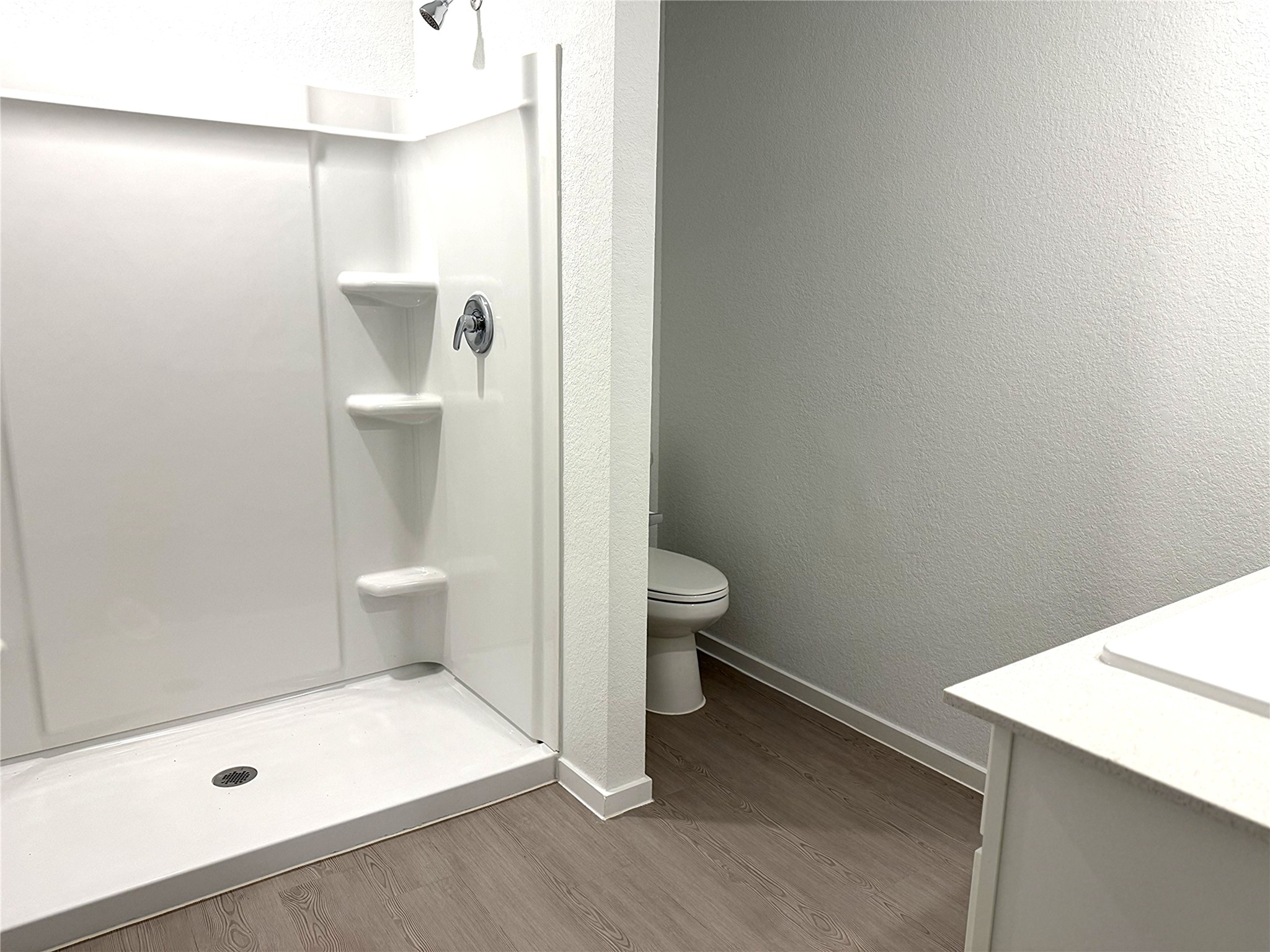 1511 Sunset Ridge Drive Conroe, TX 77306 - Photo 8 of 11 a bathroom with a toilet and a shower