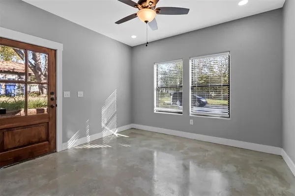 a view of an empty room with a window