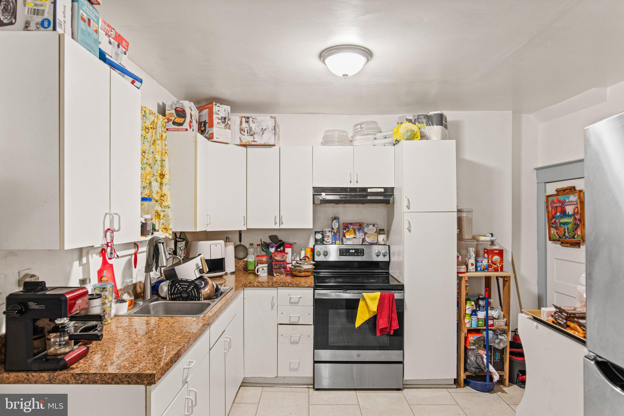 1024 Edison Street York, PA 17403 - Photo 12 of 30 a kitchen with a refrigerator and a sink