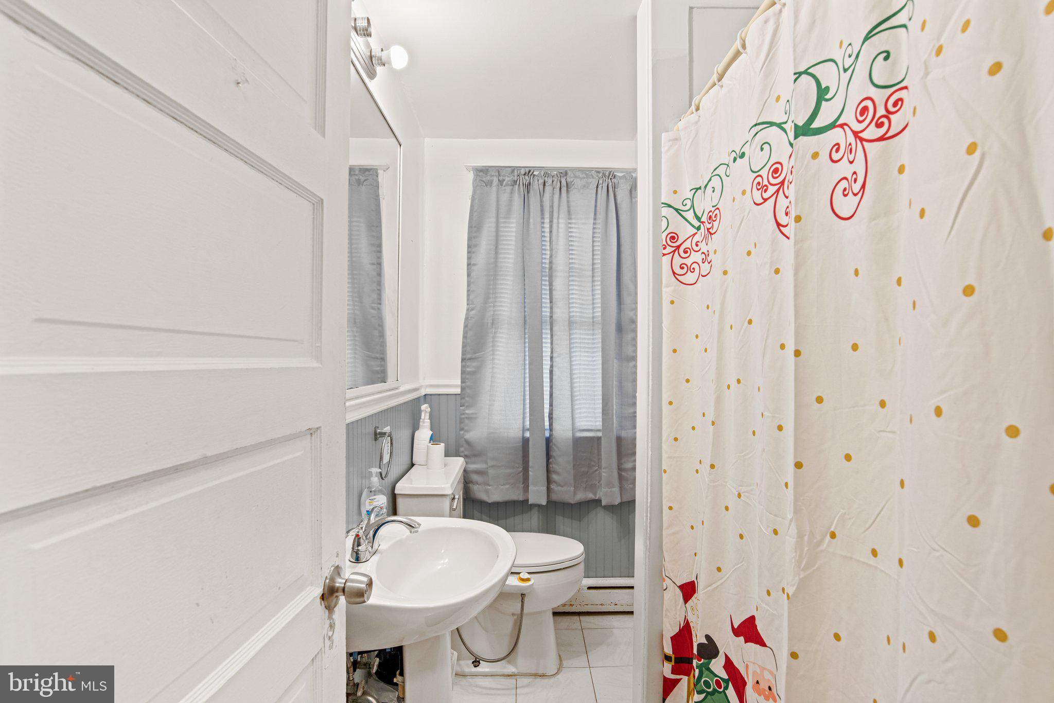 1024 Edison Street York, PA 17403 - Photo 14 of 30 a bathroom with a sink toilet and shower
