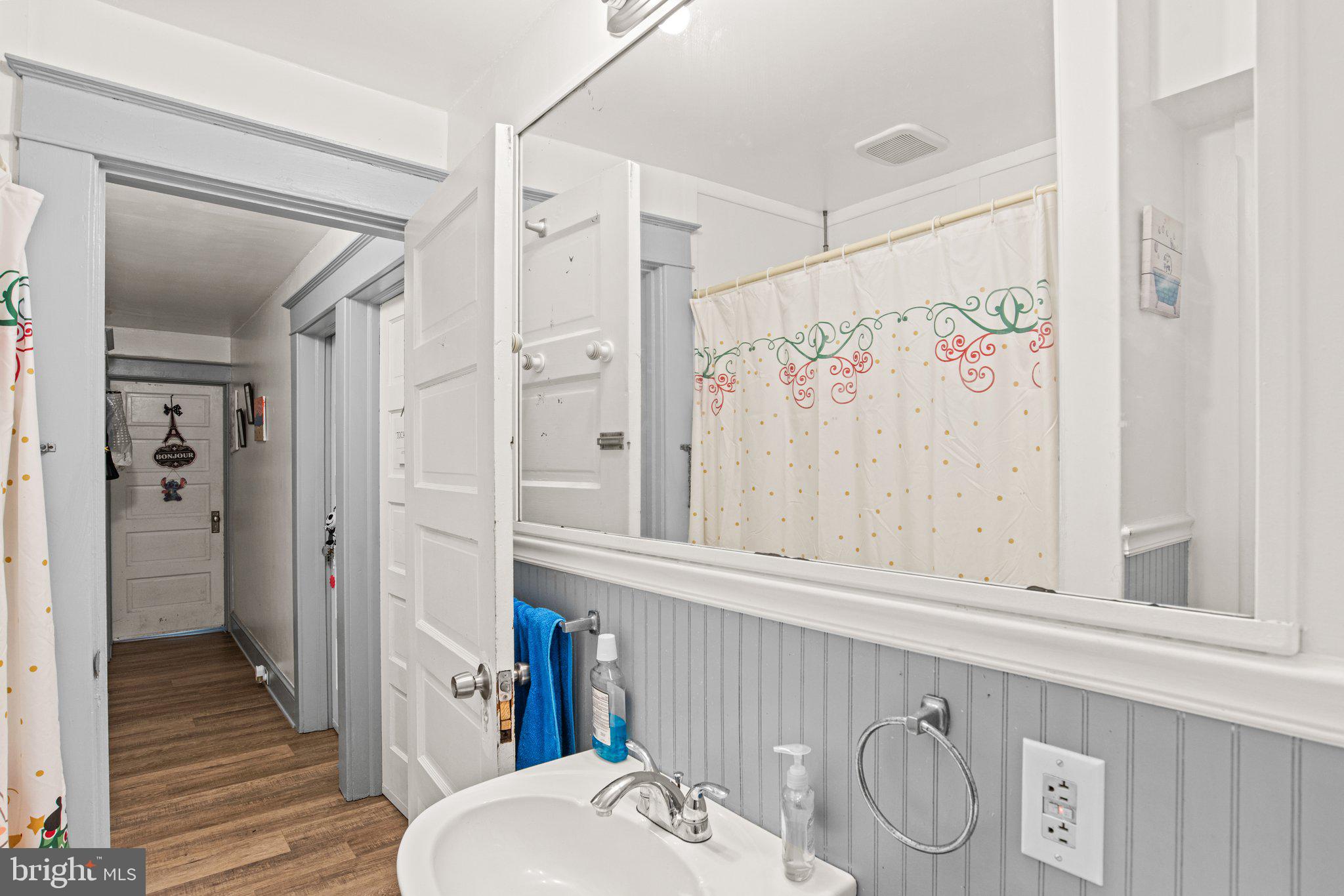 1024 Edison Street York, PA 17403 - Photo 15 of 30 a bathroom with a sink a mirror and a shower