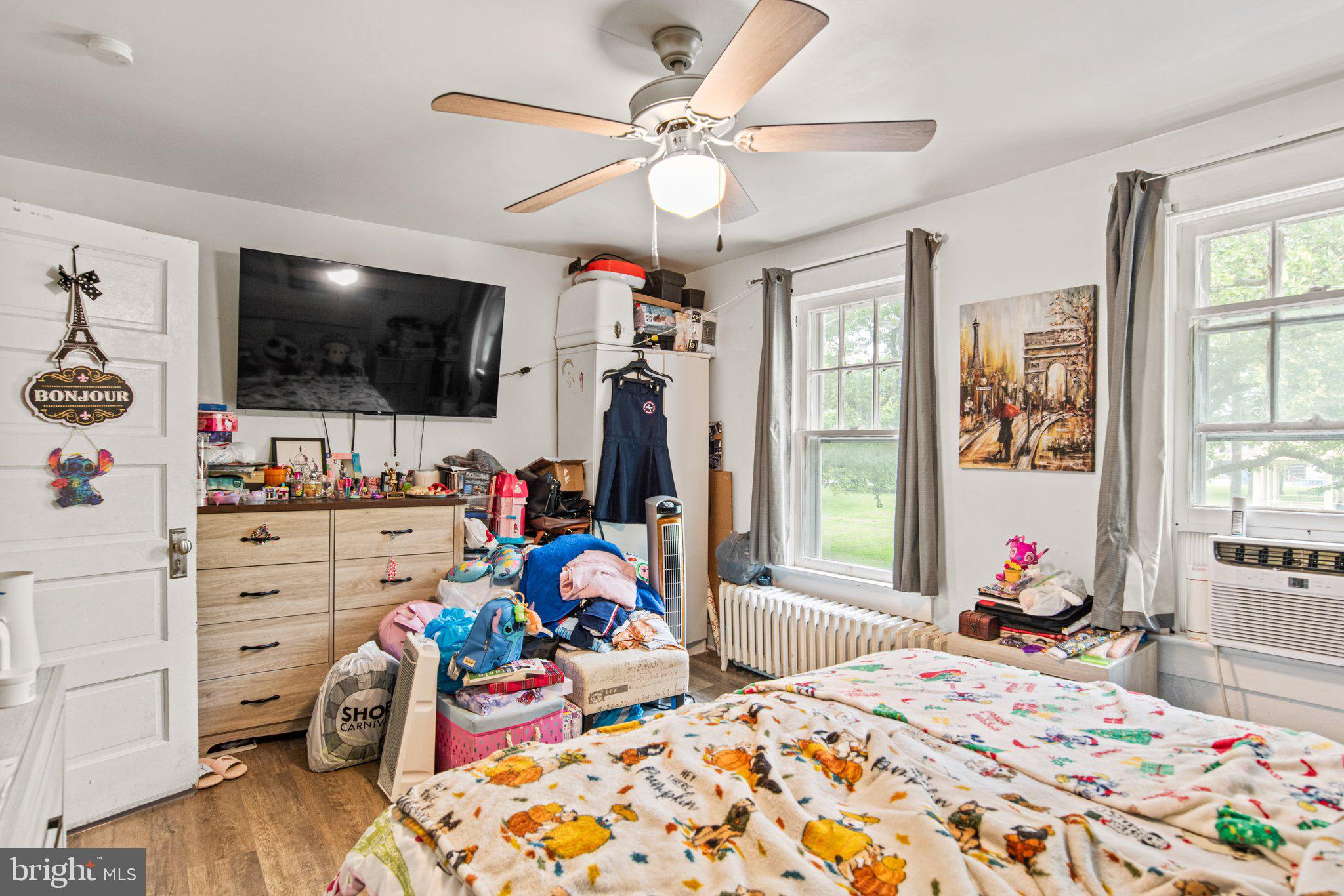 1024 Edison Street York, PA 17403 - Photo 21 of 30 a bed room with a bed a flat screen tv and a window