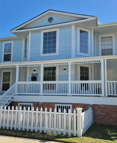a front view of a house with a deck