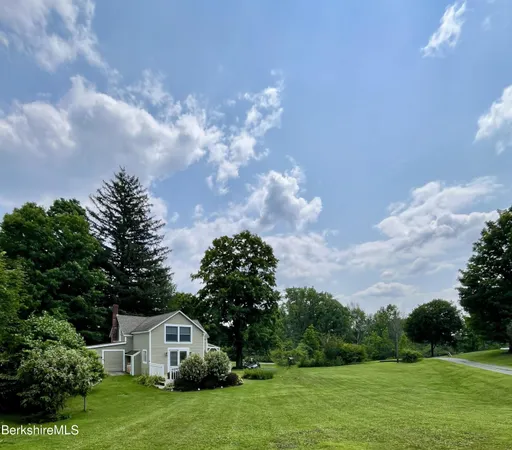 a kitchen with granite countertop a sink stainless steel appliances and cabinets