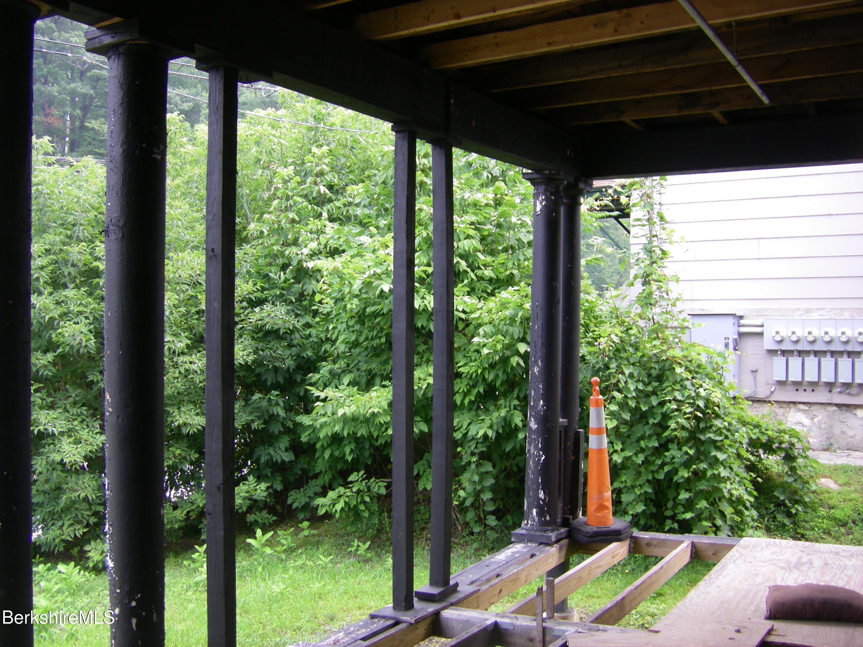 306 Union Street North Adams, MA 01247 - Photo 25 of 30 a view of a backyard with couches under an umbrella