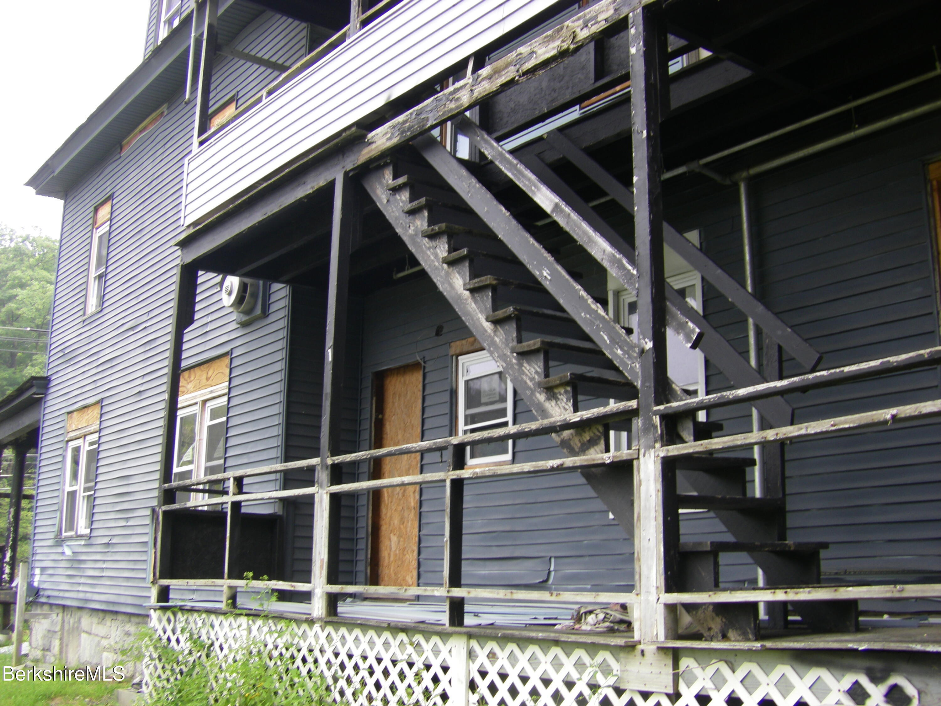 306 Union Street North Adams, MA 01247 - Photo 6 of 30 a black and white building with glass windows