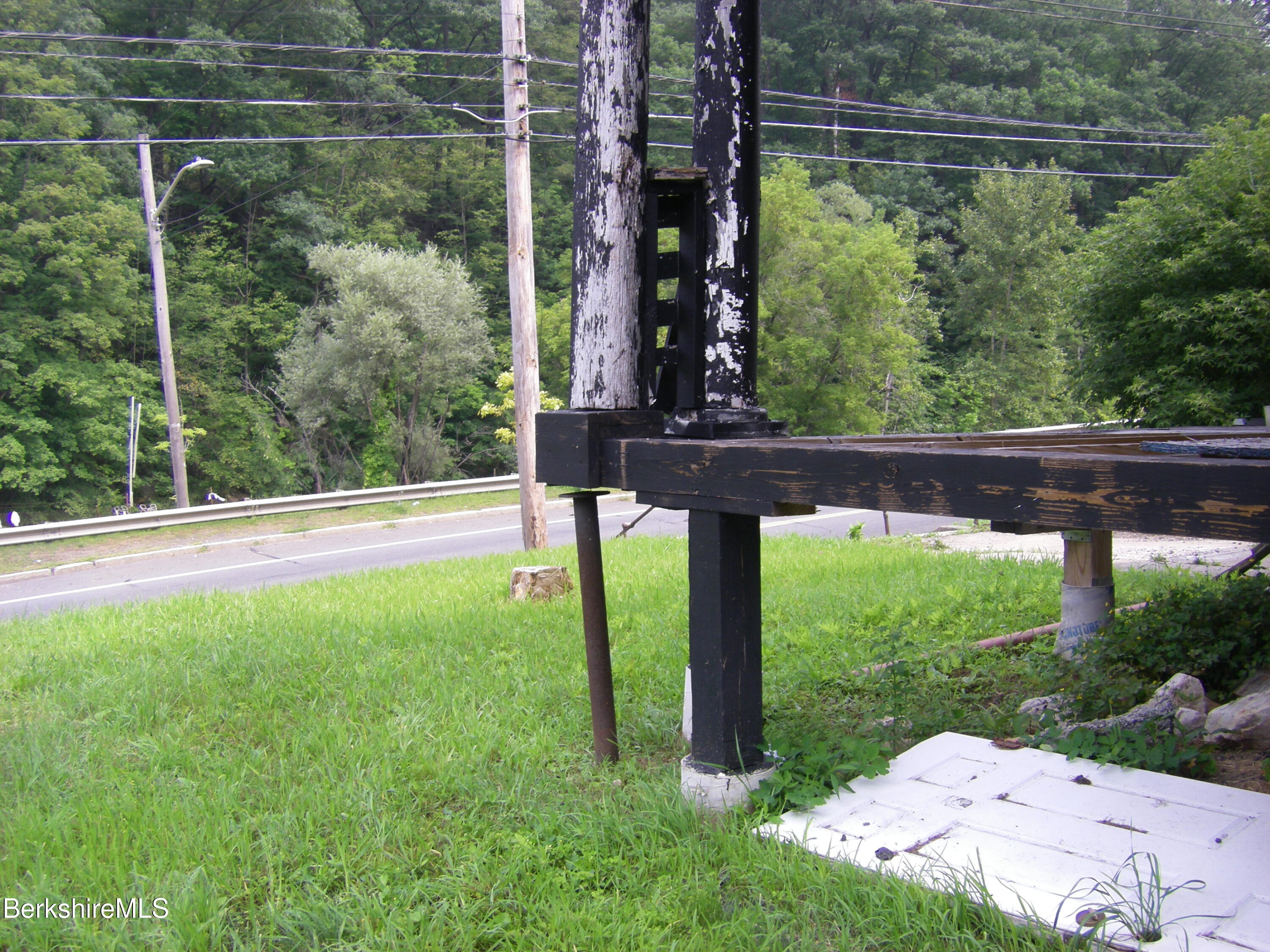 306 Union Street North Adams, MA 01247 - Photo 10 of 30 a view of a yard with a tree in the background