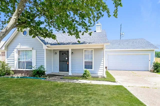 front view of a house with a yard