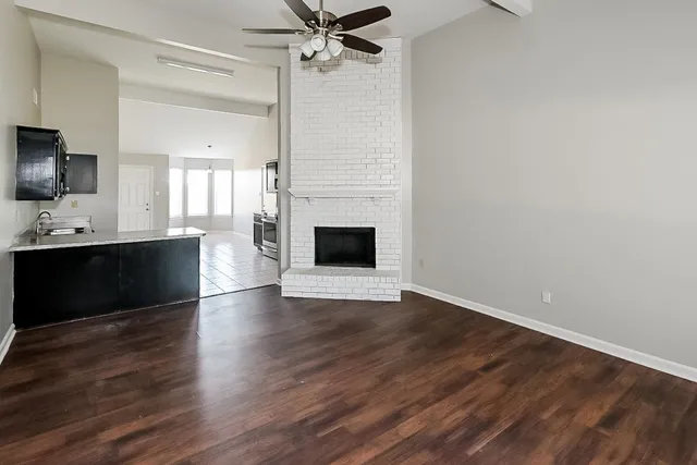a kitchen with stainless steel appliances granite countertop a sink and a stove top oven with granite countertops