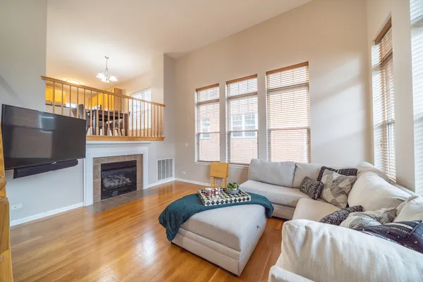 a living room with furniture fireplace and flat screen tv