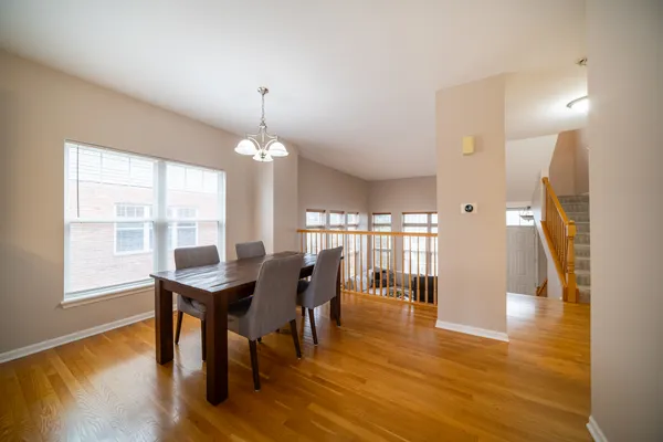a view of a dining room with furniture and wooden floor