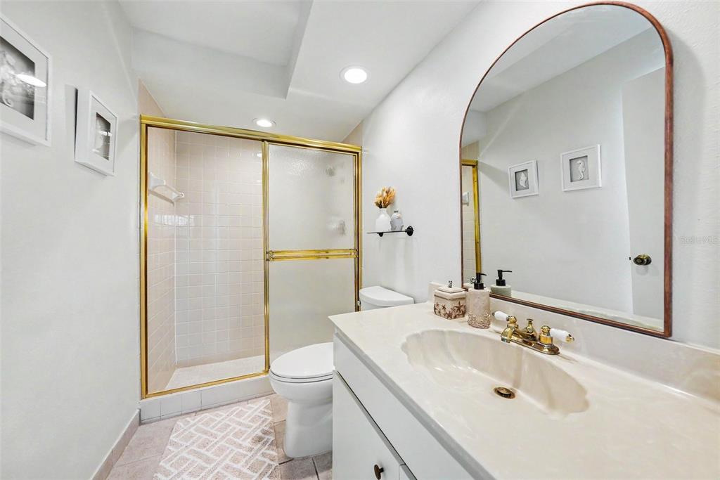9204 Golf View Drive New Port Richey, FL 34655 - Photo 25 of 33 a bathroom with a sink toilet and shower