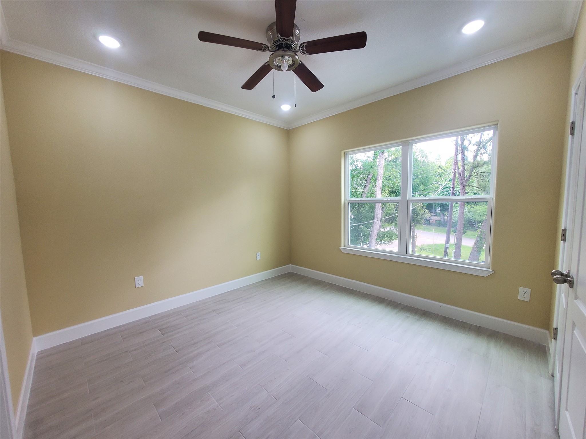1306 North 9th Street Conroe, TX 77301 - Photo 42 of 47 a view of an empty room with a window