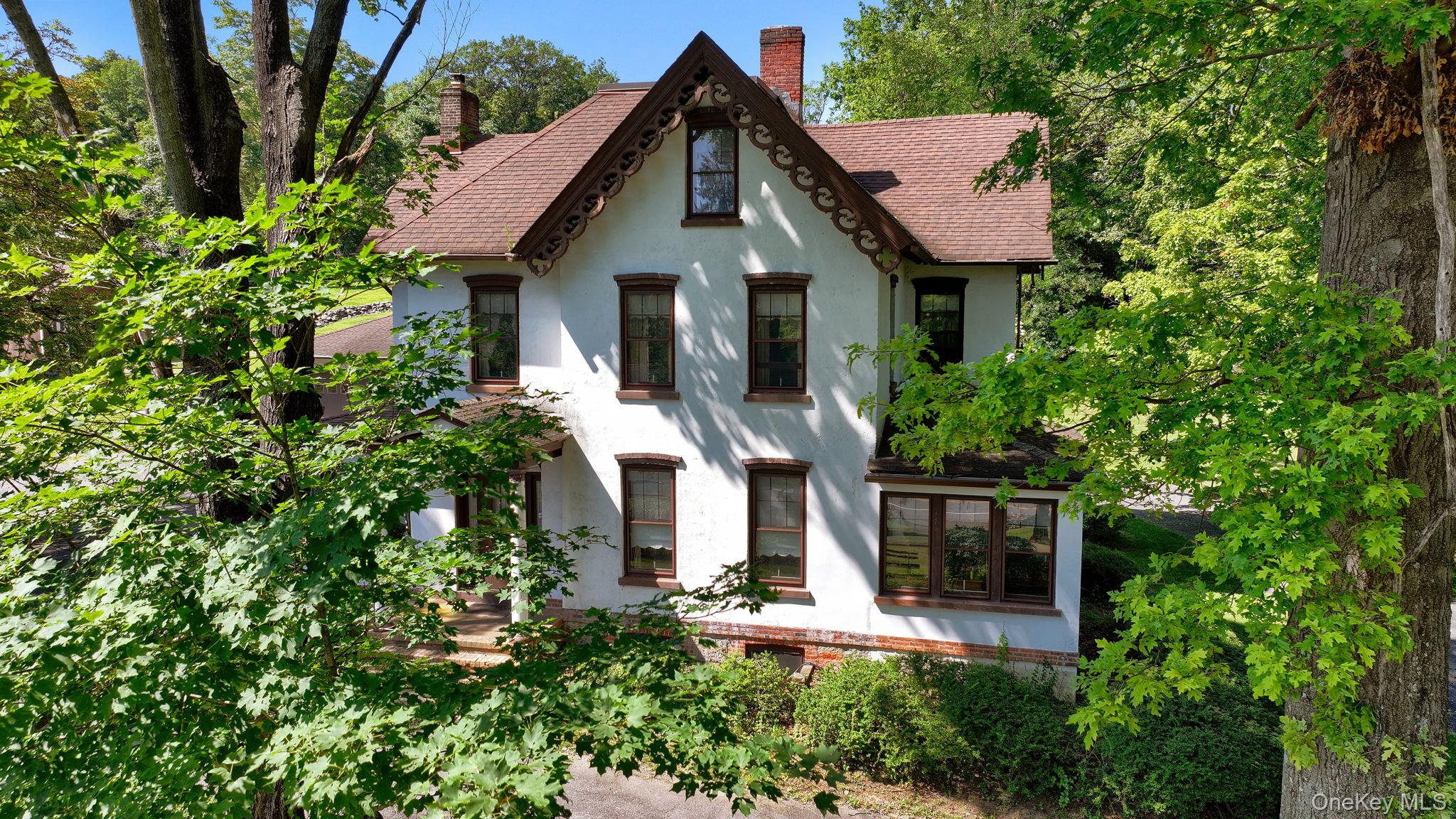 470 Little Britain Road Newburgh, NY 12550 - Photo 13 of 45 Tudor house with stucco siding, roof with shingles, and a chimney