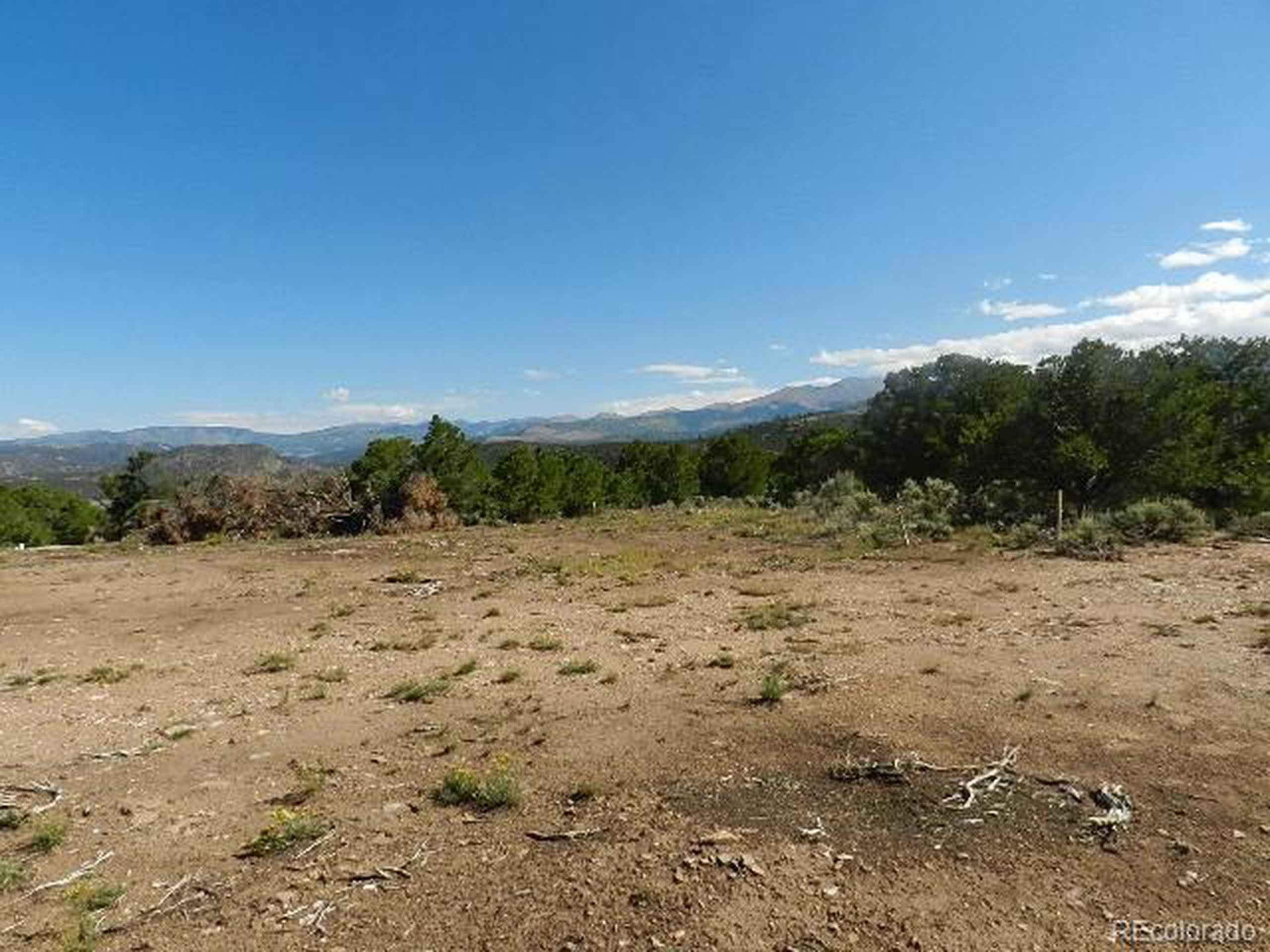 8 Mountain Ridge Lane San Luis, CO 81152 - Photo 15 of 28 a view of a dry yard with wooden fence