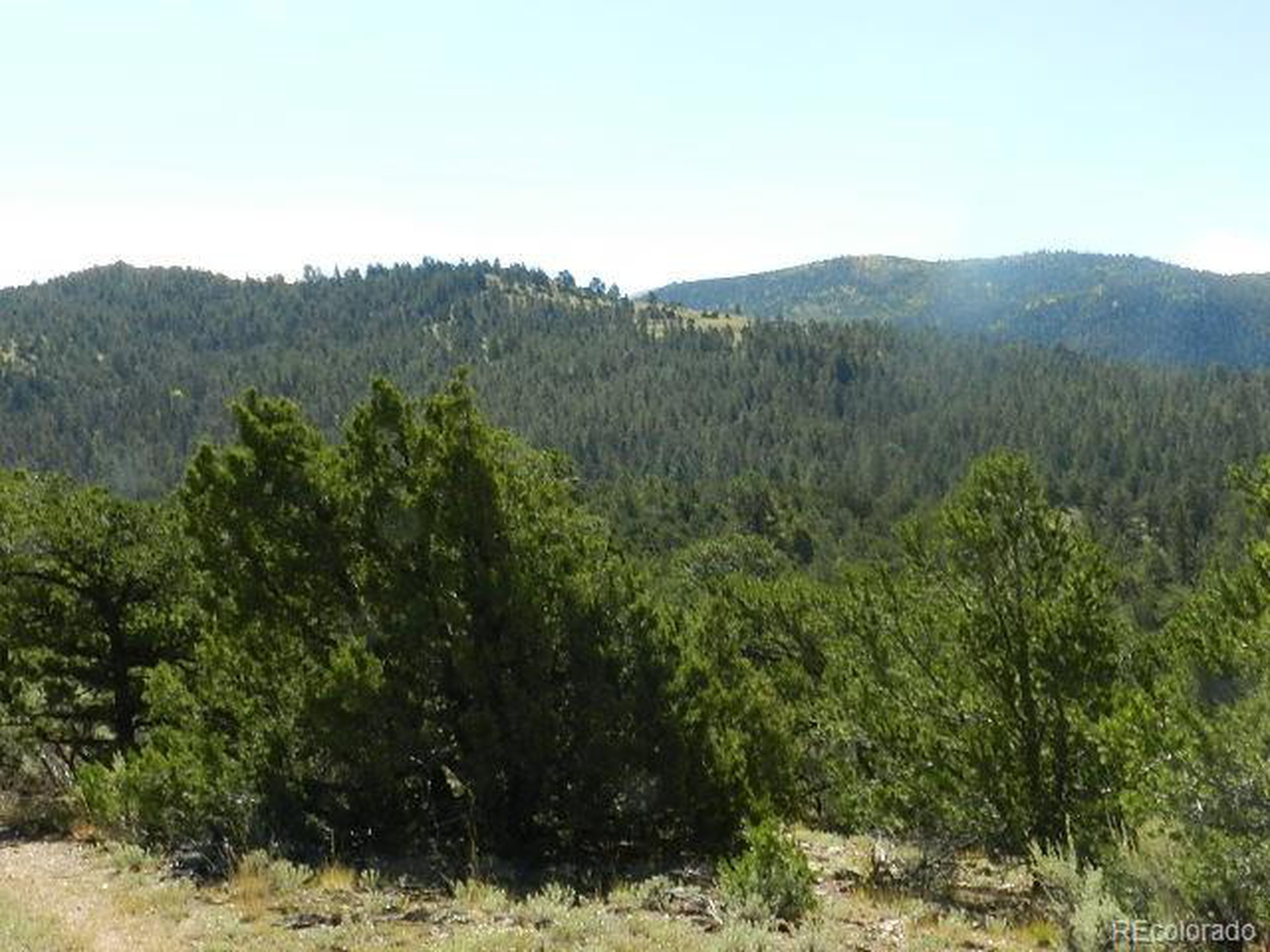 8 Mountain Ridge Lane San Luis, CO 81152 - Photo 23 of 28 a view of a mountain in the distance in a field